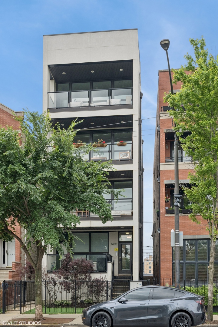 This is the one you've been waiting for! Rarely available and maintained like new construction, this 3-bedroom, 2-bath condo sits on an oversized 25x165 lot in one of West Town's most sought-after locations. Designed to impress and packed with top-tier finishes-including 8-foot solid core doors, wide-plank hardwood floors, and a sleek, contemporary kitchen with custom cabinetry, quartz countertops and high-end appliances. The flexible floor plan offers space to grow, work from home, or host out-of-town guests, with three generous bedrooms and thoughtful design throughout. The standout primary suite features spa-worthy finishes, heated floors, a steam and rain shower, deep soaking tub, and dual custom closets. Two outdoor spaces elevate everyday living, including a front terrace and a show-stopping common roof deck with jaw-dropping skyline views. Outfitted with a built-in bar, outdoor kitchenette, TV, turf area, fire pit, and pergola, it's the ultimate spot to entertain-or unwind above the city. Garage parking included. Just minutes from expressways, and the world-class dining, shopping, and nightlife of West Loop and Fulton Market. This is city living at its finest-this one checks every box, and then some. Schedule your private tour today!