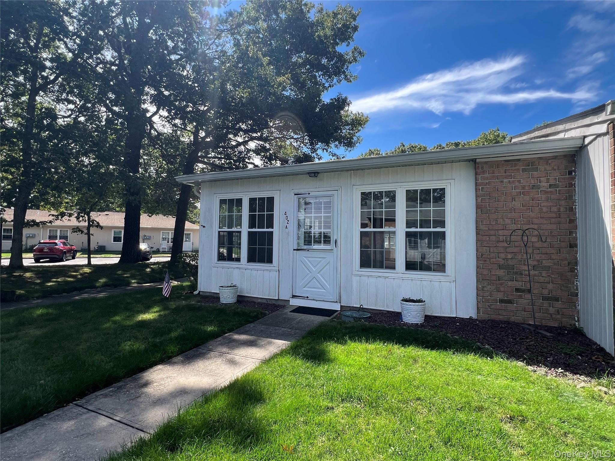 Great location. Corner unit Greenbriar Model with heated and air-conditioned porch with sliding glass doors to the living room. The extra windows make it bright and cheerful.  The location is unique with a walking path surrounded by beautifully landscaped trees and nature.  This condo offers great potential to make it your own and enjoy the golf course, swimming pool, library, gym, clubs and the many amenities Leisure Village has to offer.