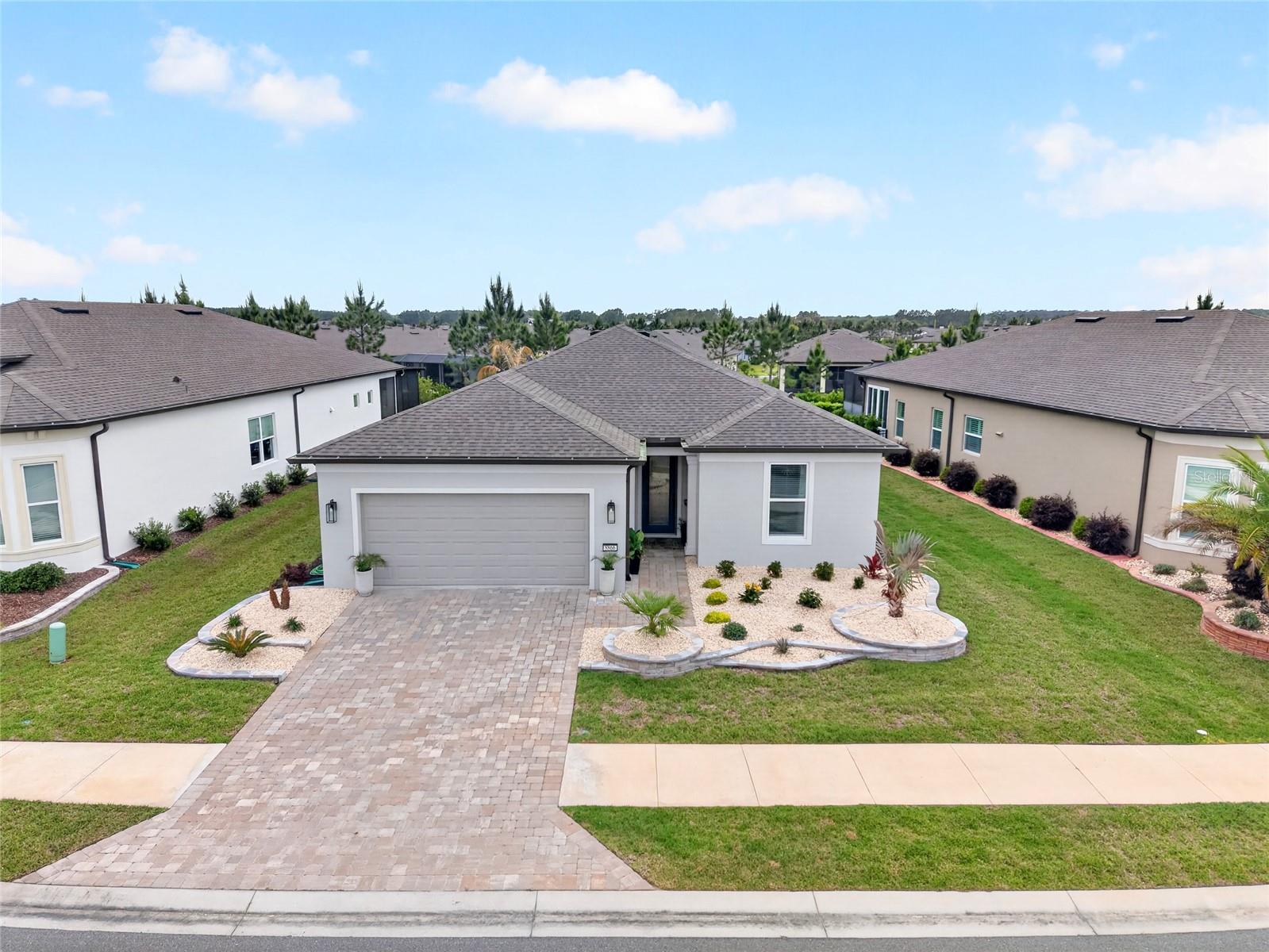2023 Mystique model located in the coveted Stone Creek community offers the perfect blend of modern design and resort-style amenities------2025 UPGRADES:  **914 sq ft pavered area with screened enclosure   **12x26 in-ground gunite chlorine pool with waterfall  **624 sq ft paver driveway    * Updated fans, light fixtures & mirrors in bathroon  *Exterior Paint  * Glass insert in front door  --------INTERIOR FEATURES:  2 bedrooms, 2 bathrooms, plus Flex Room.  Modern finishes including quartz countertops in kitchen & bathroom, counter top cook top & built in oven & microwave, 42-inch kitchen cabinets, a large island & soft close drawers.  All complemented by tile flooring and abundant natural light throughout the home. The owner’s suite provides a private retreat with a walk-in closet, dual vanities, and a walk-in shower.  2023 Air Conditioner---------EXTERIOR FEATURES:  Concrete block construction 2023 Roof,  Low maintenace curb appeal, 2 Car Garage ,  paver driveway, attractive landscaping, and a 2-car garage.  Huge covered back patio with ceiling fan--------COMMUNITY FEATURES:  Del Webb Stone Creek  is true resort lifestyle with 60,000 sq ft clubhouse complex, reunion center,  Catering/demo kitchen, Library / reading room, Card room, billiards room, game room, Arts & crafts studio, Movie theater / activity rooms, On-site retail + café/restaurant, State-of-the-art fitness center, Aerobics & dance studio, Indoor lap pool, Outdoor resort-style pool , Indoor & outdoor spa / hot tubs, Steam room / sauna, Massage & wellness services, Locker rooms , 18-hole golf course + practice facilities, Tennis courts, Pickleball courts, Bocce ball courts, Horseshoe pits, Softball/baseball Walking & biking trails, Scenic lakes & ponds, Fishing lakes / pier (catch & release) ,Parks & natural green space, Picnic areas, Dog park, RV Storage and NUCH MORE !!----- CALL TODAY WITH QUESTIONS OR TO SCHEDULE A SHOWING.
