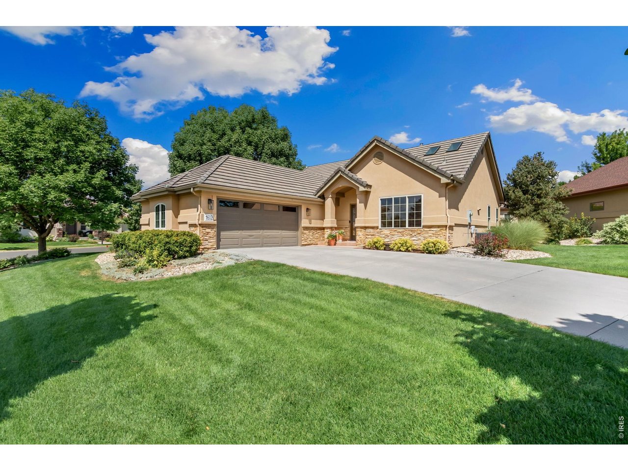Beautiful custom ranch patio home on a cul-de-sac in The Cove at Richard's Lake, ideally situated just steps from the neighborhood's private lake, surrounding trails, and the Fort Collins Country Club. Thoughtfully maintained, this home features vaulted ceilings, engineered hardwood floors, and an open floor plan. The well appointed kitchen includes an island, granite countertops, and stainless steel appliances and opens to a dining area overlooking the patio and extended outdoor living space. The inviting living room features a cozy gas fireplace. The spacious primary suite offers a 5-piece bath and walk-in closet, while a versatile flex room provides the perfect space for an office, den, hobby room, or whatever suits your needs. A conveniently located main level powder room and laundry room complete the space. The finished lower level includes two spacious bedrooms, a full bathroom, and a large recreation room with built-ins, along with a substantial storage room. The true gem of the neighborhood is Richard's Lake, where residents enjoy exclusive access to a sandy beach, covered picnic areas, and opportunities for fishing, paddle boarding, kayaking, canoeing, and small watercraft with a trolling motor. Enjoy peaceful walks along the lake, time on the water, and beautiful Colorado sunsets-all just steps from home. HOA allows split rail fences. With no metro district tax and an HOA covering lawn maintenance, irrigation, and snow removal, this is patio home living at its best.