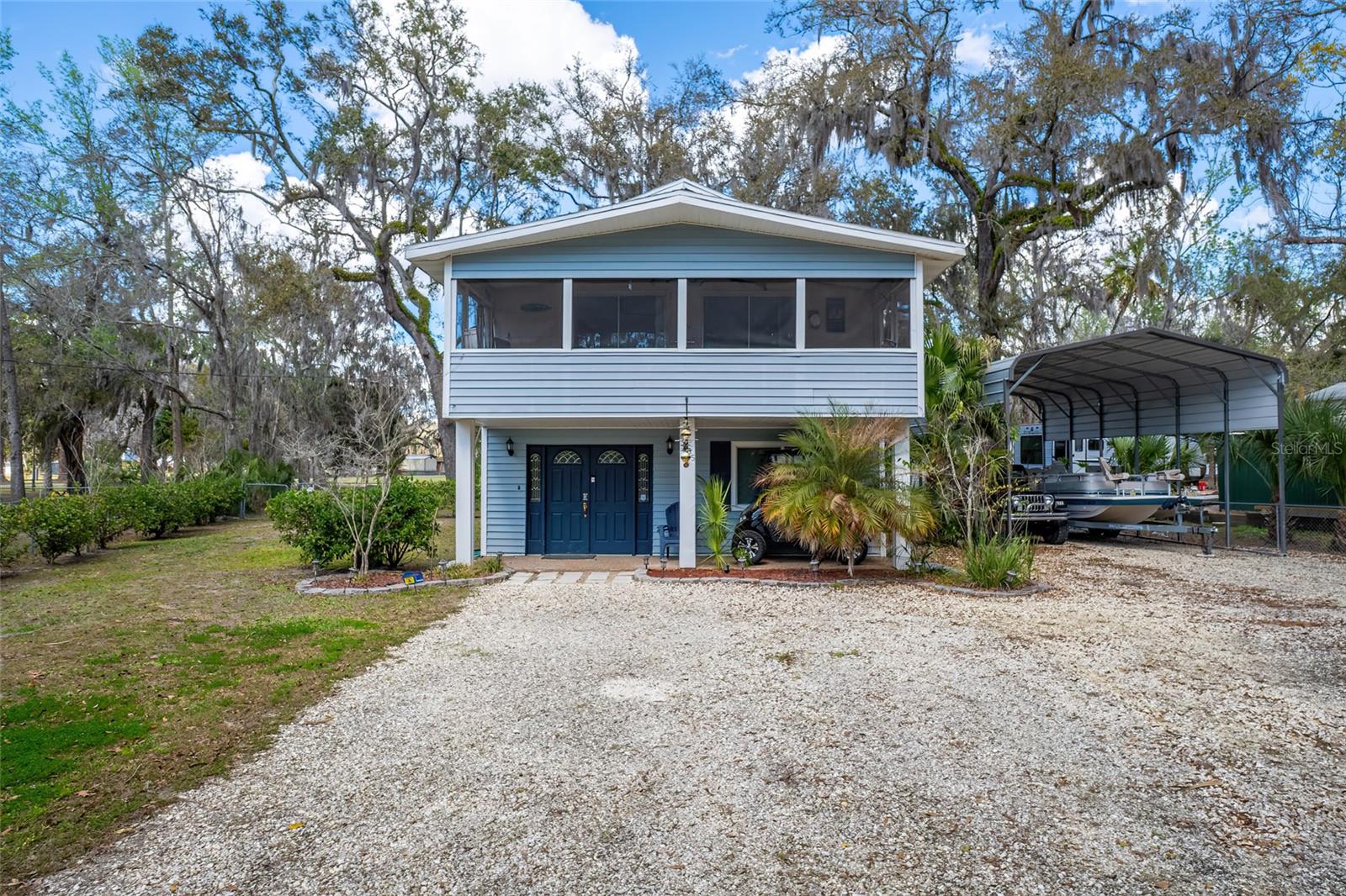 This 3-bedroom, 2 -bath, two-story home is perfectly positioned for those who love boating, fishing, scalloping, and soaking up the natural beauty of Florida's Nature Coast in Old Homosassa. Whether you're launching the boat at sunrise or cruising the neighborhood by golf cart in the evening, this home puts you right where you want to be. The main living area is upstairs, offering a inviting space with laminate wood-look flooring and access to a screened porch just off the living room-perfect spot to unwind after a day on the water. Downstairs features a spacious secondary living area, flex space, with beautiful wood-plank style tile flooring and a cozy fireplace, creating a warm gathering space for guests and family. A full bathroom and laundry area are also located on the lower level, providing flexibility for visitors or extended stays. Recent updates provide peace of mind, including a new HVAC System, roof replacement in 2020, updated electrical outlets (including dryer outlet) and replacement windows. Step outside to enjoy the back patio and shed great for storing fishing gear, kayaks, or all your river toys. Some of the furnishings convey, making this an easy move-in opportunity for a full-time residence, or weekend retreat. Property is being sold As-Is and ready for its next adventure.