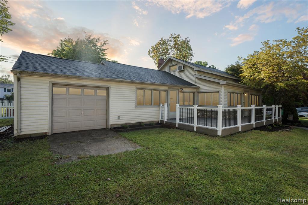 Charming Historic Home in the Heart of Downtown Williamston! Step inside this beautifully maintained historic home just steps away from all the shops, dining, and charm that downtown Williamston has to offer. The inviting front entryway, complete with built-in storage cubbies, sets the tone for the thoughtful updates and timeless character found throughout. The main level features freshly painted walls, newer light fixtures, and hardwood floors hidden beneath the carpet, ready to be revealed and restored to their original beauty. The updated kitchen boasts modern finishes and a clean, functional layout, while the updated bathroom adds style and comfort. A versatile non-conforming third room offers endless possibilities — create a home office, a guest bedroom, or a flexible space to suit your needs. Step outside to your own private backyard with mature trees that create a serene, shaded retreat. A large deck provides the perfect spot for morning coffee, evening barbecues, or entertaining friends and family. The heated, insulated garage/workshop with a new garage door is ideal for hobbies, projects, or extra storage. Historic charm, modern updates, and an unbeatable location — this home has it all.