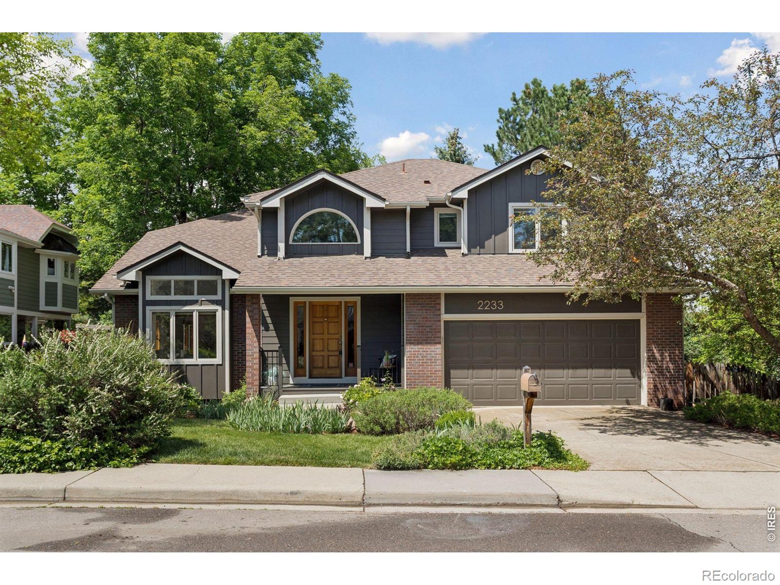 Tucked into a quiet cul-de-sac in coveted Kalmia Meadows, this south-facing 5-bedroom, 3.5-bath home offers space, light, thoughtful updates, and a true neighborhood feel in a sought-after pocket of central North Boulder. With three bedrooms upstairs and two additional bedrooms in the finished basement, the layout offers flexibility for a variety of living needs. Step inside to a welcoming foyer with lofted ceilings that extend into the living and dining rooms, creating an airy first impression. The kitchen, updated in 2020, features abundant storage, a sunny eat-in area, and newer KitchenAid appliances. It flows seamlessly into the family room with a cozy gas fireplace-ideal for everyday living and entertaining. Step outside to a lush, expansive backyard perfect for relaxing or hosting gatherings. The back deck was redone in October 2025 with durable composite materials, while beautiful flagstone paths and patio areas enhance the outdoor living spaces. Mature landscaping creates a peaceful outdoor setting. Significant recent system upgrades provide long-term peace of mind: exterior siding and gutters were fully replaced in 2025, and in 2024 the home received a new HVAC system and water heater. A sump pump adds additional protection-the home remained dry during the 2013 flood. An attached two-car garage adds convenience and storage. Upstairs, the spacious primary suite includes a private balcony and a five-piece ensuite bath with double sinks, in-floor heat, a generous shower, and a walk-in closet. Two additional bedrooms and a full bath complete the upper level. The finished basement offers two additional bedrooms, a full bathroom, a large rec room, and ample storage-ideal for guests, home offices, or flexible living needs. Next to a neighborhood path and nearby Parkside Park, with easy access to Boulder's extensive bike and walking trail system, hiking, shops, and restaurants, this home combines a quiet setting, central location, and extensively updated systems.