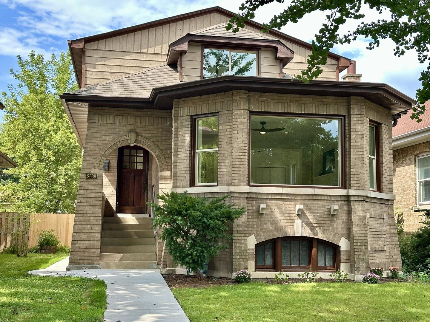 This beautifully renovated home in desirable Northwest Evanston is a rare opportunity, featuring five bedrooms, four full bathrooms, and high-end finishes throughout.    The home was taken down to the studs and comprehensively renovated, including all-new copper plumbing, including the main line (no lead), new electrical wiring and panel, insulation, windows, basement perimeter drain tile and sump pump, two additional bedrooms, two additional bathrooms, new cabinetry and appliances, flooring, a newer roof, interior and exterior paint, patios, walkways, and landscaping. All renovations were completed with permits and feature exceptional finishes, including marble in all four bathrooms.    The spacious and thoughtfully designed floor plan renders a comfortable flow between multiple living spaces, making the home optimal for both everyday living and entertaining. The upper level features 11-foot cathedral ceilings in the family room and primary bedroom, with abundant natural light streaming through oversized windows and three skylights.    The primary suite extends a private retreat with a sitting room, balcony, and luxurious private bathroom. The main level includes a generous living room, den, sunroom, dining room, bedroom, and full bathroom.    The finished basement, with 7-foot ceilings, adds significant versatility and living space. It includes a fifth bedroom, full bathroom, and expansive area for a home office, gym, recreation room, or guest space. With a separate entrance and an area already plumbed for a kitchen, the basement also presents potential for a private guest suite or rental arrangement.    Outside, enjoy the peaceful backyard, with both sunny and shaded areas for relaxing or entertaining.     With its substantial architectural features, solid-brick masonry, and a tree-lined setting, this home has the best of comfort, character, and convenience. It is situated in a quiet, well-maintained neighborhood just minutes from the lake, local shops, restaurants, parks, and vibrant Northwestern University. Some photos have been virtually rendered.