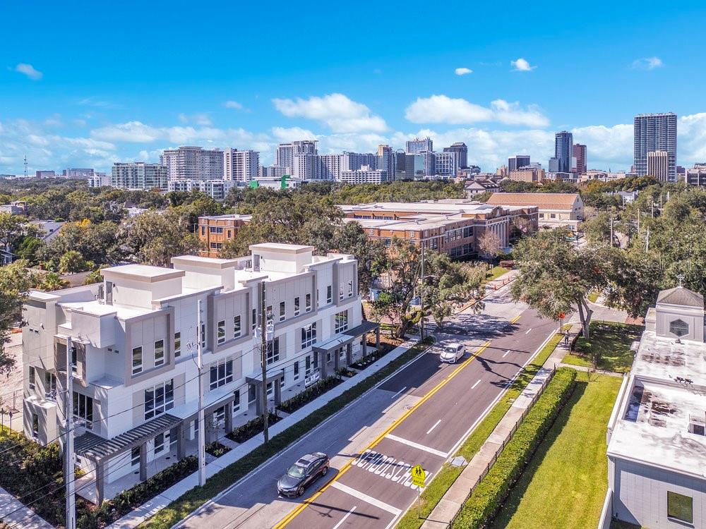 BRAND NEW 2025! Early bird gets the worm! Over $65k of complimentary upgrades of elevator, upgraded cabinetry, modern wine wall staircase lighting for the first sales.  Units professionally designed by Carla Acosta Interiors. Vilasa Thornton Park combines luxury with location in the heart of Thornton Park. Experience upscale living in this, three-story corner townhome in the vibrant Thornton Park neighborhood, where you can walk to dining, coffee shops, shopping, and just blocks from Lake Eola and Downtown Orlando. Designed for both elegance and convenience, this home features a private elevator, a spacious open layout, and stunning city views. Upon entering, you’re welcomed by a large foyer leading to a versatile first-floor bedroom with an en-suite bathroom-ideal as a private guest suite, home office, or in-law suite. This level also includes a two-car garage with a generous storage closet. The second floor is bathed in natural light, showcasing a gourmet kitchen with stunning, custom floor-to-ceiling cabinetry, high-end appliances, quartz countertops, and floor to ceiling windows. The open-concept dining and living areas provide ample space for relaxation and entertaining, rich with character and warmth. On the third floor, you’ll find a secondary en-suite bedroom and a cozy open space-perfect for a reading nook, sitting area, or home office. The primary suite is a true retreat, boasting spacious closets and a luxurious bathroom with abundant storage and natural light. Upgraded end unit, offers unparalleled views of Downtown Orlando. The 11-unit townhome community, including a duplex, is perfectly positioned near Thornton Park’s charming restaurants, boutiques, and salons. Lake Eola’s vibrant events, Sunday Farmer’s Market, and yoga in the park are just steps away, offering a lifestyle rich in culture and recreation. Walk to broadway shows at the Dr. Phillips Center, basketball at Kia Arena, and Michelin-starred restaurants in the Mills 50 District are all within a short distance. With Orlando Health and AdventHealth a couple miles away, this home is the perfect match for medical professionals. Don’t miss your opportunity to own an elegant urban retreat in one of Orlando’s most sought-after neighborhoods. Vilasa Winter Park sold out in record time. Trusted and reputable builder, Jordan Homes. Vilasathorntonpark.com