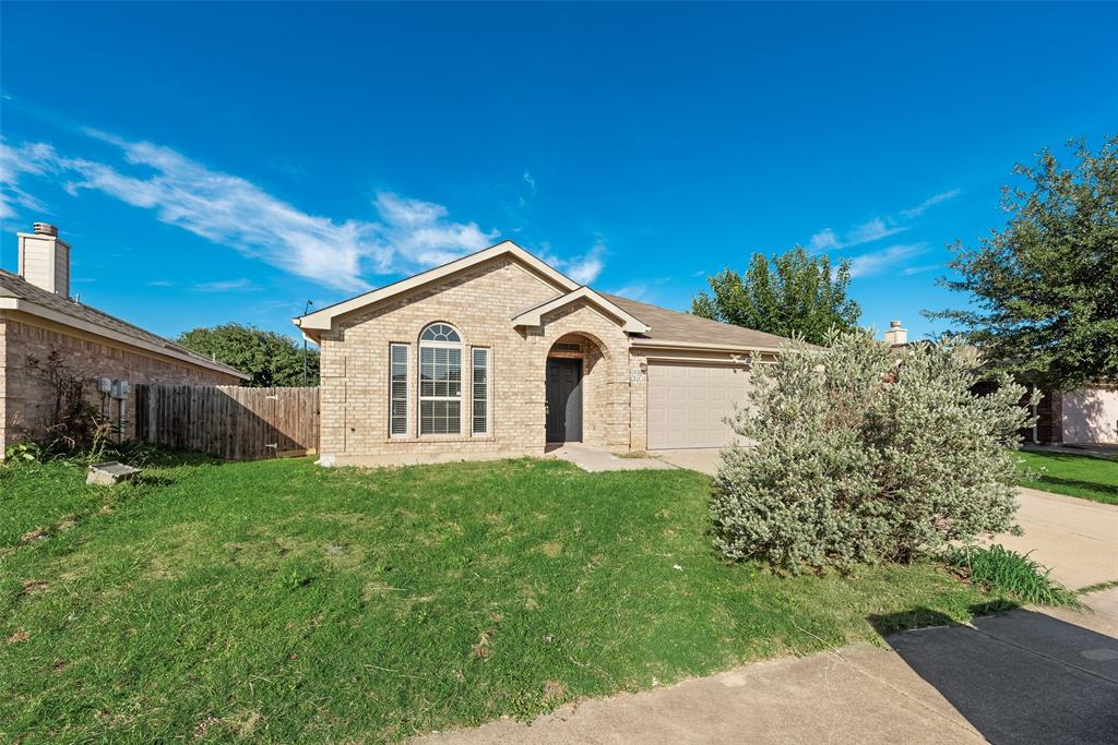 Welcome home!  This beauty is ready for you! Charming 4-bedroom, 2-bath, 2-car garage home featuring 2 living areas and 2 dining areas. The formal living and dining combo offers great space for entertaining. Spacious kitchen with island overlooks the second living area with a cozy corner brick fireplace. Split-bedroom floor plan provides added privacy. Large primary suite includes dual sinks, garden tub, separate shower, and walk-in closet. The home comes with fresh new paint throughout, new laminate flooring, and new stainless steel electric stove range and dishwasher! The back yard has a fenced backyard perfect for outdoor enjoyment. Conveniently located for quick access to highways and entertainment. Don't miss out on this opportunity to make it yours!