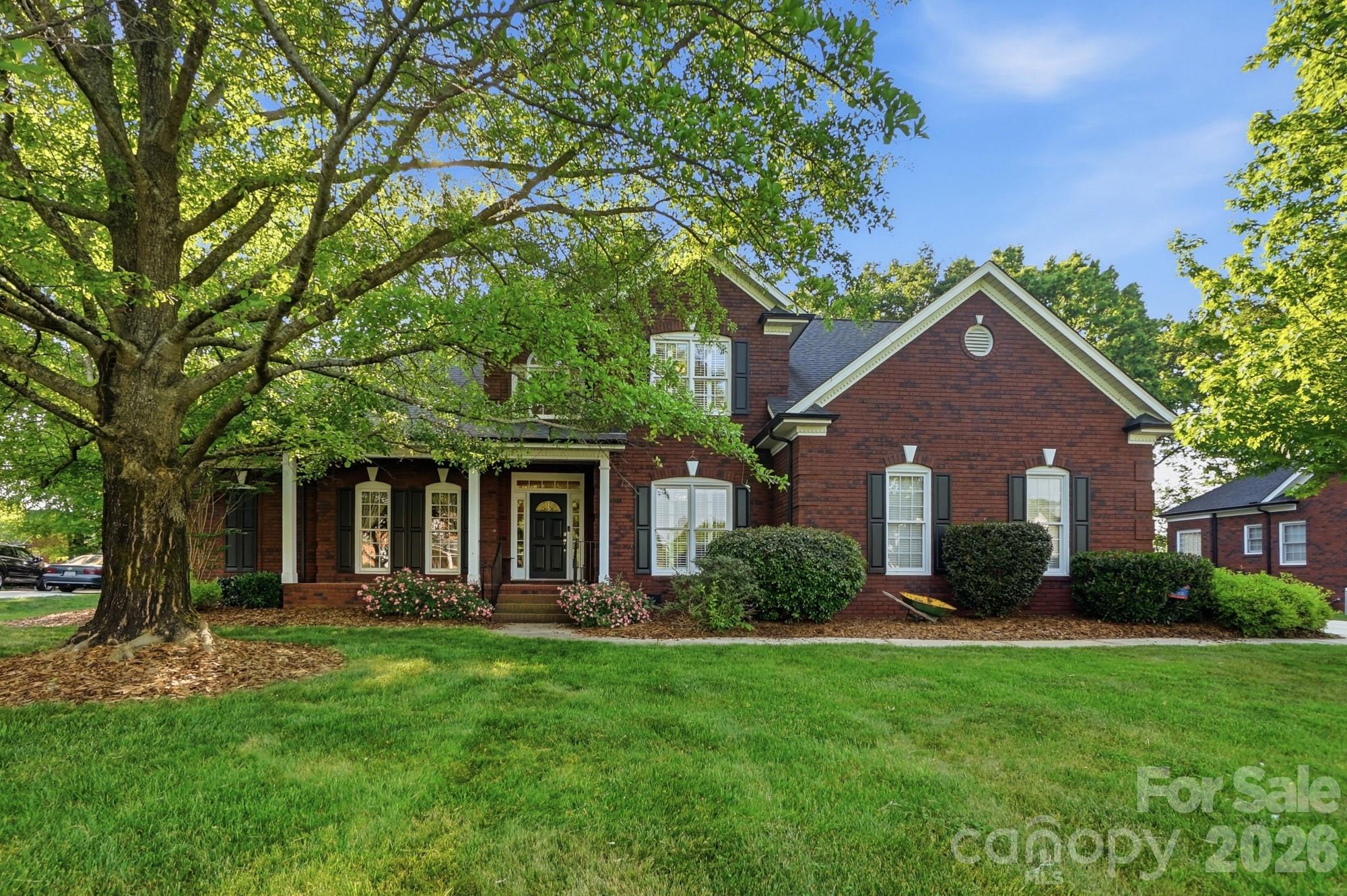 Welcome home to this well-loved one owner home in the established Flowers Farms neighborhood in Harrisburg.   This home has 5 bedrooms and 3 full baths with 2 bedrooms on the main floor including the primary suite.   The spacious primary suite on the main level has a tray ceiling and 2 walk-in closets with en suite bath with separate jetted tub, and shower, two sinks and water and linen closets. The upstairs has a bedroom that could be used as another primary bedroom and approximately 400 square feet of walk-in attic space.  The almost 600 square foot 2-car garage has built-in cabinets and workbench and peg board that remain.  Most of the almost 3/4 and acre home site is irrigated by well water and the back almost 1/5 of an acre is not in the HOA.  There is an almost 350 square foot deck and almost 200 square foot screen porch overlooking the wooded backyard.  The kitchen has tons of cabinets and counter space with an island, tile backsplash and a butler's pantry connecting the elegant formal dining room.   Our other favorite features include brick exterior, large welcoming front porch, encapsulated crawl space, 4 walk-in closets and lots of storage space, laundry room with sink and cabinets, wood flooring and shutters throughout, molding on the main level, archways, skylights, and recently serviced gas fireplace.  Roof updated in 2017.  HVAC updated in 2018 with Trane.  Hot water heater updated in 2018.  Appliances have been updated in the past 10 years.  Refrigerator, washer and dryer are included with an acceptable offer. There are too many details to list, so schedule your appointment to view.