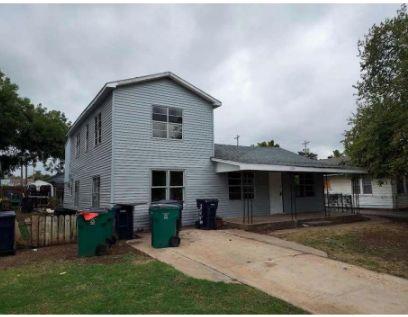 SELLER FINANCING AVAILABLE! AS-IS Investor Special.  Property has 1,274 square feet in the main house and 570 square foot apartment upstairs.  There is a 644 massive workshop that opens to the street behind the property and was formerly a commercial business.