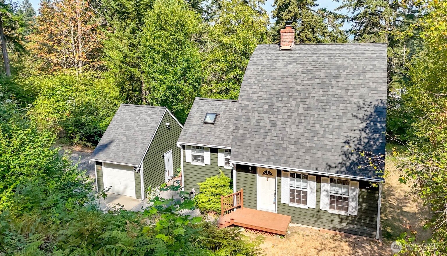 Welcome home to this charming, beautifully maintained property situated on 1.25 private acres in the highly desirable Sumner area, where privacy, comfort and character come together. The light-filled main floor features stunning exposed beams, wide-plank hardwood floors and warm, welcoming tones throughout. The inviting living room is centered around a beautiful rock wood-burning fireplace, adding to the home's distinctive character. The kitchen offers stainless steel appliances, an eating bar and vaulted ceilings, with French doors opening to the deck overlooking a serene, wooded setting—perfect for relaxing or entertaining. This special home offers 2 bedrooms and 1¾ beautifully remodeled baths. Cedar siding enhances the home's natural Northwest appeal, while a newer roof, HVAC system, A/C and ductwork provide comfort and peace of mind. Exceptionally well maintained and truly move-in ready. Enjoy the space and privacy of 1.25 acres while still being conveniently located near charming downtown Sumner, Lake Tapps, shopping, dining and amenities. From the moment you walk through the door, this is a home that simply feels like home.