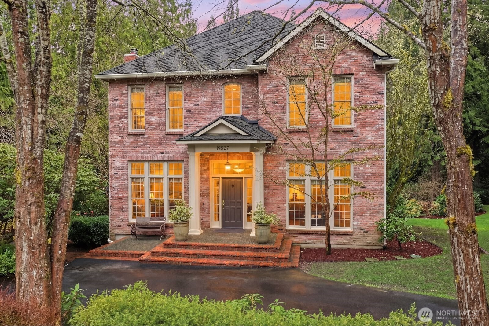 Step back in time & experience this beautiful, well maintained custom Georgian Colonial home, nestled on 1.57 lush acres in  Woodinville's wine country. 4,340* sq ft plus an additional 410* sf flex space, this 4-bedroom, 3.5-bath home offers the space, function & charm you’re looking for. Designed for both everyday living & grand entertaining, the open layout features formal living & dining rooms, butler’s pantry & a chef’s kitchen w/cherry cabinetry, slab soapstone counters, large island, walk-in pantry & premium appliances including Viking, Sub-Zero & Miele. The sunny informal dining area & gathering room w/gas fireplace create a warm, welcoming hub. The main-floor primary suite offers convenience & privacy, complete w/a sitting area, fireplace, spa-like bath w/travertine finishes, soaking tub, walk-in shower & expansive closet w/attic storage. Upstairs includes 3 additional bedrooms, a Jack & Jill bath, ensuite bedroom & bonus rm w/hidden kitchenette-ideal for guests or multigenerational living. Enjoy alfresco dining on the newer Timbertech deck, expansive lawn for outdoor pursuits, fruit trees & backing to greenbelt. 3-car garage, RV parking & versatile finished flex space provide room for hobbies, a gym, office, or media room. Quality details shine throughout: reclaimed full brick exterior, wide plank cherry hardwoods, extensive millwork, double sashed Pella windows, new Presidential roof (2024), AC, Generac generator, tankless H20, EV charger & great Northshore schools.