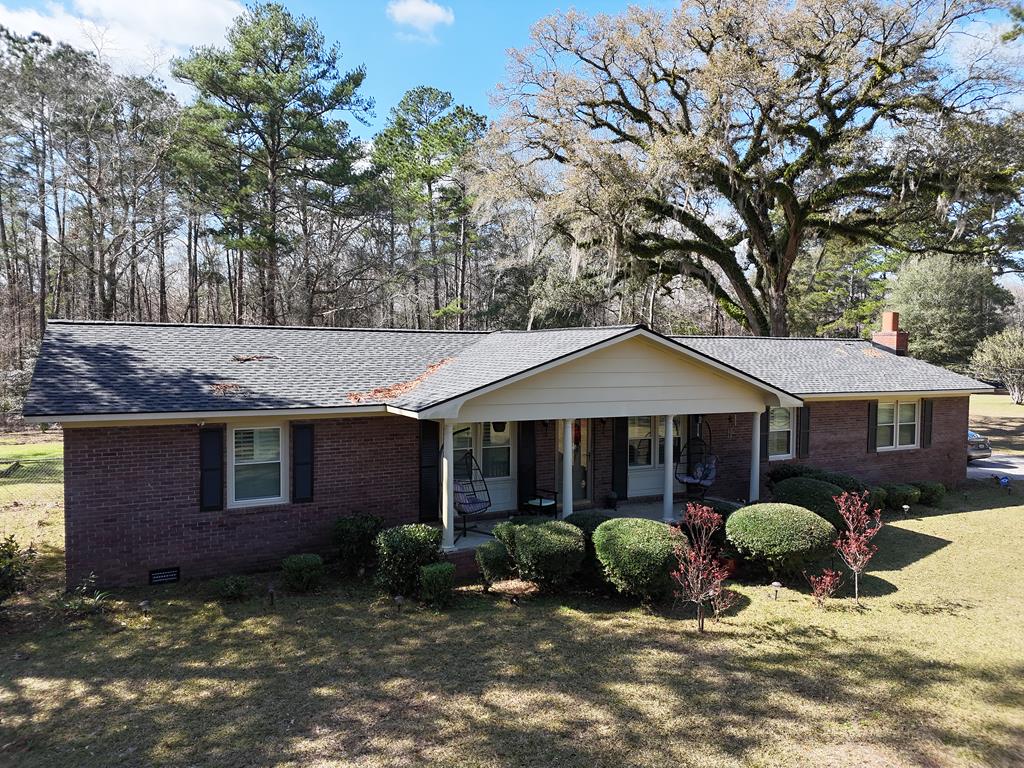 Traditional ranch home in an established neighborhood sitting on 1.32 acres. The back yard is fenced with fruit trees, a garden area, storage building, and plenty of room to entertain. This green space is large enough to host a large BBQ while watching football. The open concept main living area is perfect for the lifestyle of households today. Everyone can be included in the daily activities while preparing and enjoying dinner celebrations. The kitchen is equipped with real wood countertops that shine and give a wow factor. The den or family room has a beautiful fireplace ready for the cool winter nights. Enjoy the holidays hanging stocking on the mantle and roasting marsh mellows by the fire. Plantation shutters adorn the windows throughout the home giving a luxurious feel to the home. The primary bedroom has a walk-in closet and ensuite bath with a nice walk-in shower. Two additional bedrooms, a full bath located across from bedrooms. If you are needing a great home with a large yard to entertain and garden, in a peaceful setting, this home is waiting for you. Call today to view this home and see how you could be enjoying Christmas by the fire.