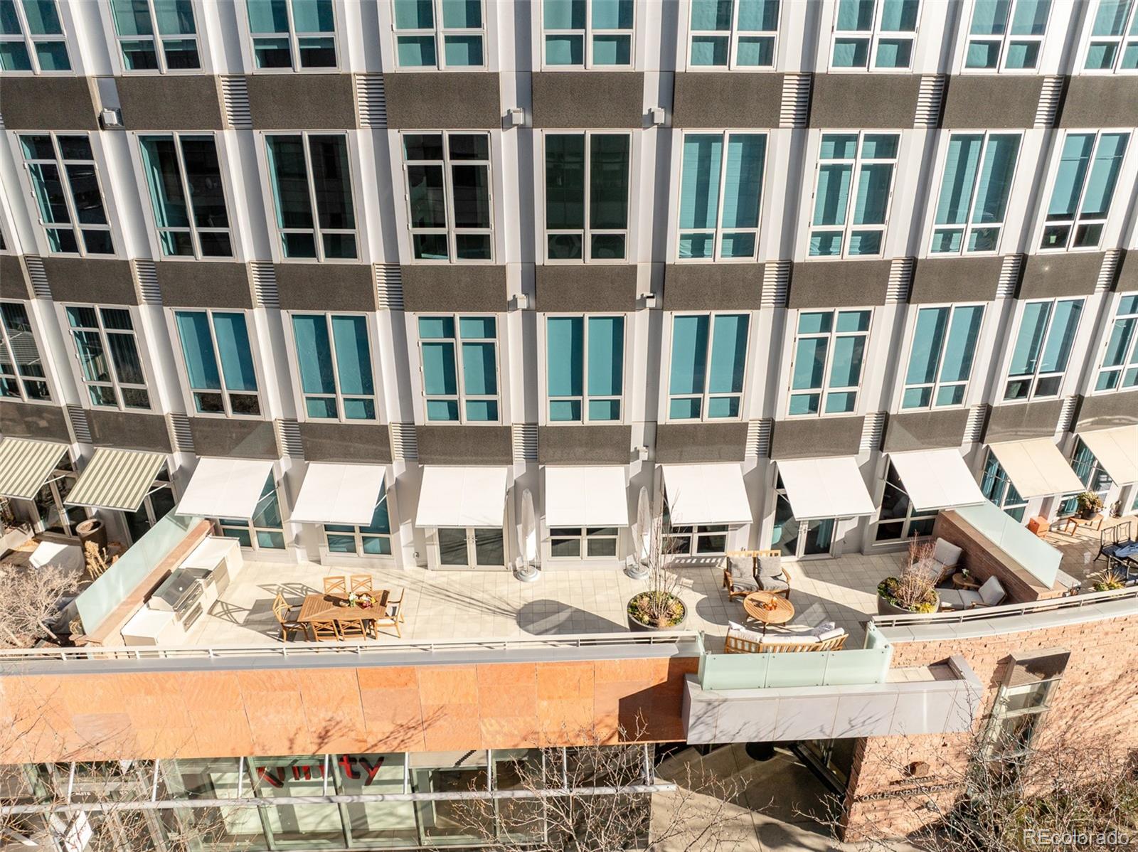 True Luxury whispers its arrival at North Creek, Cherry Creek North's most coveted enclave, this 2 plus bed and 3 bath home underwent a bespoke transformation, completely rebuilt from the studs up with opulent high-end finishes throughout. The moment you are received through the foyer, the great room welcomes you with uncompromising quality, where custom lighting and gas fireplace encased in quartzite anchor warmth flowing into a dining area crowned by a dancing teardrop chandelier that transforms intimate gatherings into unforgettable occasions. This exquisite kitchen redefines culinary artistry with Jenn-Air gas range and appliances, precision Miele dishwasher, and quartzite surfaces while an eat-in island serves both solitary mornings and grand entertaining, adjoined with ample pantry, wet bar and Samsung smart laundry elevating every practical detail. The primary suite, a tranquil retreat illuminated by a stunning chandelier and elegant bedside pendants, features an ensuite boasting extensive marble finishes, spacious steam shower and gorgeous lighting opens directly onto your private 1000-square-foot patio—a Cherry Creek rarity—with new tile, irrigated landscape planters and complete outdoor kitchen featuring transformative Al Fresco grill, warming oven and refrigerator where new exterior canopies orchestrate light seamlessly integrating indoors and out. The gorgeous guest bedroom with ensuite including steam shower, floor to ceiling windows, elegant drapery, linen covered walls and floating marble vanity ensures every visitor experiences thoughtful luxury. A flexible snug adapts as private office or intimate den, adjoining powder room. Two deeded parking spaces plus dual storage complete this curated sanctuary. Nestled within Cherry Creek North's protected community with 24-hour concierge—craftsmanship with soul, exclusivity with substance, functional beauty that enhances every day. Welcome to a narrative so rare it becomes irresistible. Furnishings negotiable