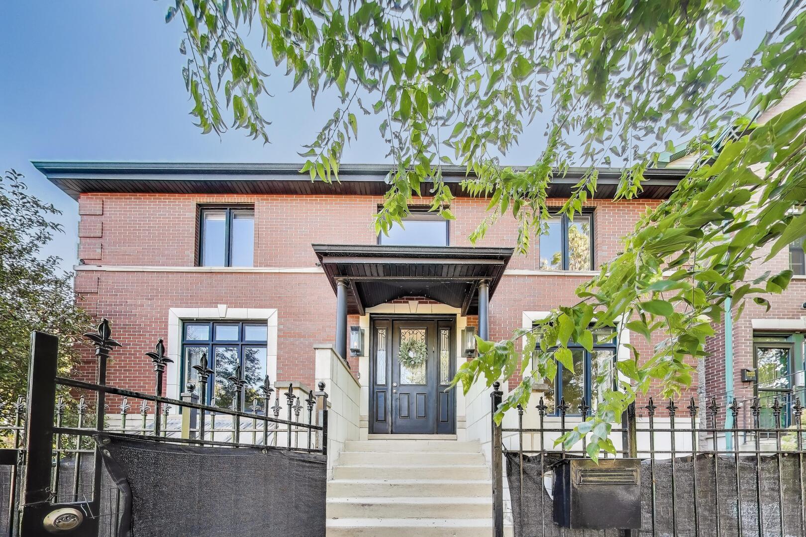 New to market is a Stunning All-Brick American 4 Square in Bucktown!  This elegant 4-bedroom, 3.5-bathroom home offers the perfect blend of timeless architecture and modern amenities in one of Chicago's most sought-after neighborhoods.  Step into a bright and inviting living room featuring floor-to-ceiling windows and a cozy gas fireplace. The spacious dining room is ideal for entertaining, while the gourmet kitchen is outfitted with granite countertops, stainless steel appliances, and a built-in banquette seating area for casual dining. Double glass doors open onto a large enclosed back deck which was remodeled with composite decking in 2024, creating seamless indoor-outdoor living.  Upstairs, hardwood floors flow throughout three generously sized bedrooms and two full bathrooms. The expansive primary suite boasts a custom walk-in closet and spa-like bath with heated floors, dual vanity, soaking tub, and separate shower.  The fully finished lower level offers a versatile living area with a wet bar and access to a private enclosed terrace-perfect as a garden center, playroom, or year-round retreat. An additional bedroom with en-suite bathroom features heated floors and a luxurious steam shower. Additional features include: Attached two-car garage with extra storage, Outdoor living spaces designed for both relaxation and entertaining. Exceptional location in vibrant Bucktown, close to dining, shopping, and public transit.