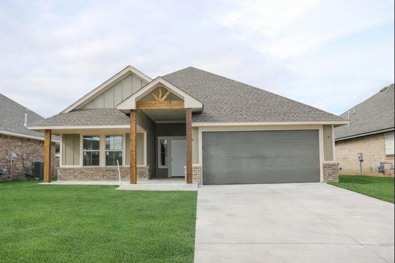 Ask about our incentives! Step onto the covered porch with its charming accents and inviting atmosphere, then enter an open living area where comfort and style meet a beautifully designed kitchen featuring a large island, spacious pantry, custom cabinetry, and thoughtful details throughout. The serene primary suite includes a ceiling fan, abundant natural light from energy-efficient windows, and an en-suite bath with dual vanities, a garden tub, a walk-in shower, and generous closet space. Secondary bedrooms are set apart for privacy and are complemented by a guest bath featuring a tiled tub and shower combo. Backed by a 10-year structural warranty and manufacturer warranties, this home offers lasting peace of mind. Schedule your private tour today!