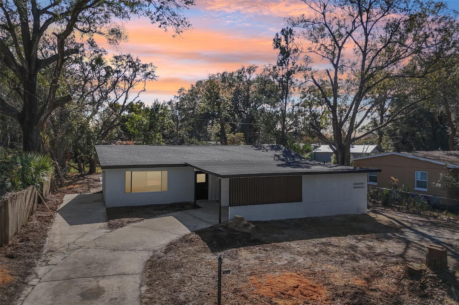 Stunning Fully Renovated 5 Bedroom Pool Home in Orlando – Move-In Ready & Perfect for Entertaining! Welcome to this beautifully renovated 5-bedroom, 2-bathroom home offering 1,802 square feet of modern living space designed for comfort, style, and functionality. This home has been completely transformed and features a brand-new roof, a newly resurfaced private pool, luxury vinyl plank flooring throughout, and a fully upgraded kitchen showcasing quartz countertops, shaker-style cabinetry with modern hardware, stainless steel appliances, and a spacious island perfect for gatherings. The open-concept layout provides multiple living and dining areas, creating flexibility for large families, multigenerational living, or those who love to entertain. Both bathrooms have been tastefully remodeled with modern finishes, updated vanities, and stylish tile work. Step outside to your oversized backyard featuring a sparkling pool, large patio area, and plenty of space to create your own outdoor oasis. The property also offers ample parking with a covered carport and extended driveway. Conveniently located near major highways, shopping, dining, and entertainment, this home offers the perfect combination of modern upgrades and everyday convenience. Schedule your private showing today and come experience everything this beautifully updated home has to offer!