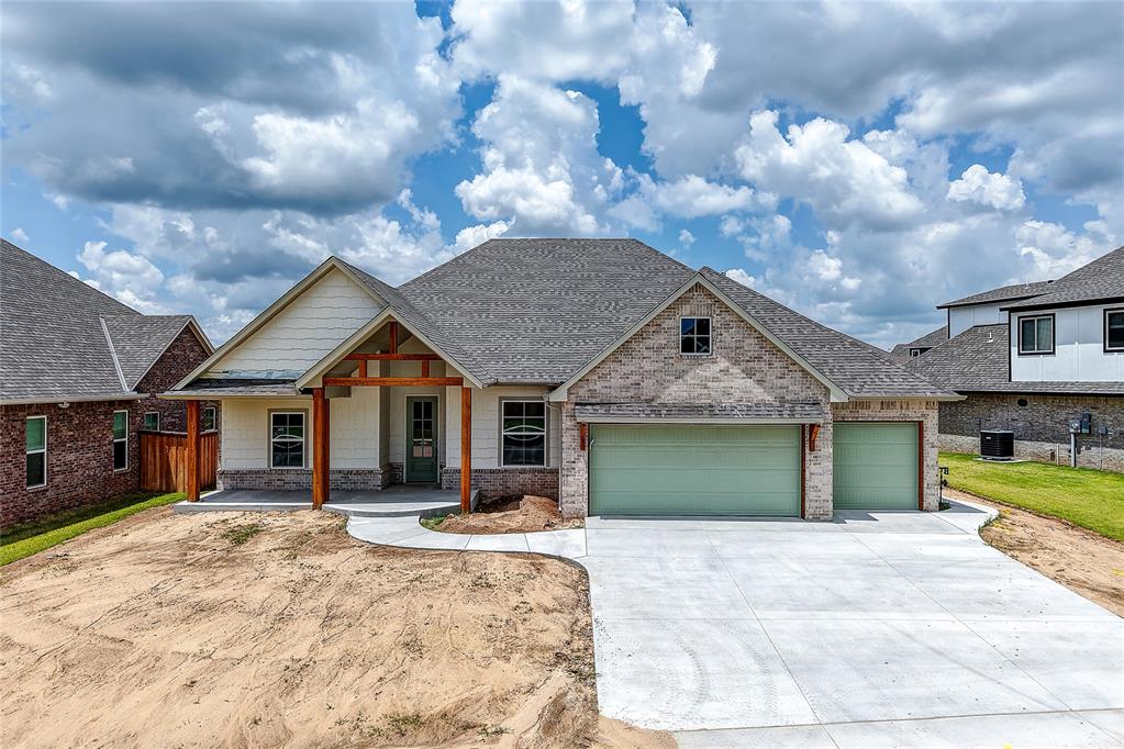 Welcome to this beautiful new construction home in the sought-after Cedar Lane neighborhood, just two miles from the University of Oklahoma campus. This thoughtfully designed home offers a spacious open layout with a stunning vaulted living area that creates a bright, welcoming atmosphere the moment you walk in. Large windows throughout the home fill every room with natural light.The heart of the home features custom cabinetry, a generous kitchen layout, and a walk-in pantry that provides both style and functionality. Just off the main living area, you’ll find a versatile flex space that can easily serve as a home office, guest bedroom, or hobby room.The private primary suite is designed to feel like a retreat, featuring a spacious bathroom with designer tile finishes, an oversized walk-in shower with a rainhead, and a beautiful freestanding tub that adds a true spa-like feel. On the opposite side of the home, two large secondary bedrooms are connected by a convenient Jack-and-Jill bathroom, and each bedroom includes its own walk-in closet.Step outside to the large covered back patio, complete with a cozy wood-burning fireplace — an ideal space for relaxing evenings or entertaining family and friends.