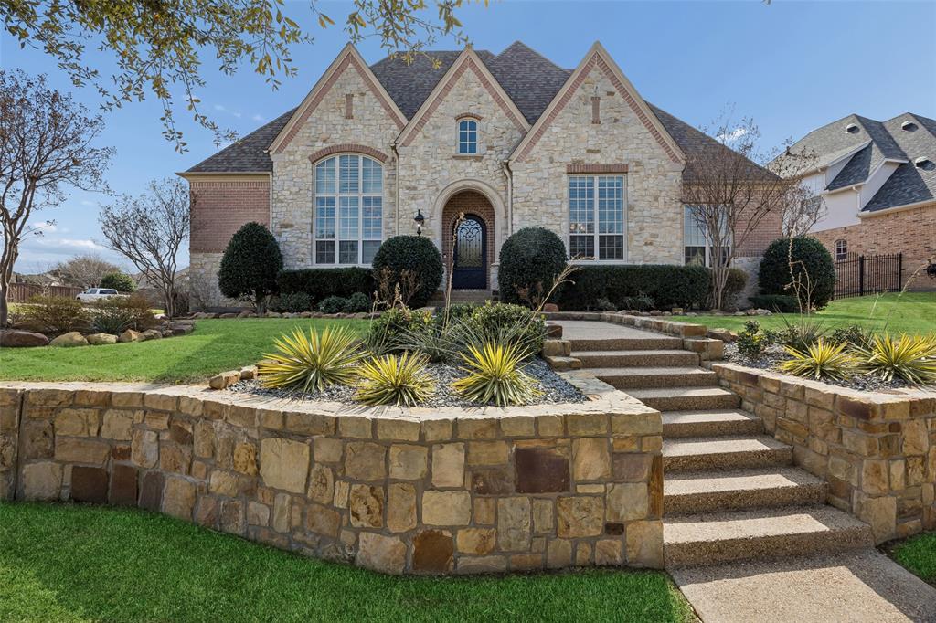 SELLER IS OFFERING $5000 TOWARDS BUYERS CLOSINGS COSTS OR A RATE BUYDOWN. Located within the prestigious Castle Hills, this extraordinary Huntington Custom estate is a masterclass in refined elegance. Perfectly positioned on a prime corner lot. Recently enhanced with a beautifully remodeled kitchen, a fully renovated primary bath, freshly painted interior + brand-new carpet throughout. Boasting 5 bedrooms, 4 full baths & 2 half baths, the home balances sophistication with comfort. Main level is anchored by a luxurious primary retreat & complemented by a private executive study & a separate guest suite, ideal for multi-generational living or long-term visitors. Arrival is unforgettable. A striking iron front door opens to reveal hand-scraped hardwood floors, solid-core doors, custom plantation shutters, soaring ceilings, and dual staircases that showcase the home's exceptional craftsmanship. The remodeled chef’s kitchen is nothing short of spectacular, appointed with a professional-grade Wolf range and double ovens, a built-in Sub-Zero refrigerator, extensive custom cabinetry & effortless flow into the expansive living & entertaining spaces. Designed for seamless indoor-outdoor living, natural gas service extends to the covered patio, providing the perfect foundation for a future outdoor kitchen & resort-style backyard retreat. Upstairs, generously sized secondary bedrooms are accompanied by a spacious game room & a dedicated media theater, creating the ultimate setting for recreation & relaxation. 3 HVAC systems, including a recently replaced upstairs unit, ensure year-round comfort. Additional highlights include a gated 3-car courtyard garage, abundant storage + oversized WIC's throughout. This is luxury without compromise, an exceptional opportunity to own a distinguished estate in one of North Texas’ most coveted golf communities, where timeless architecture, premium updates & an unmatched lifestyle come together in perfect harmony.