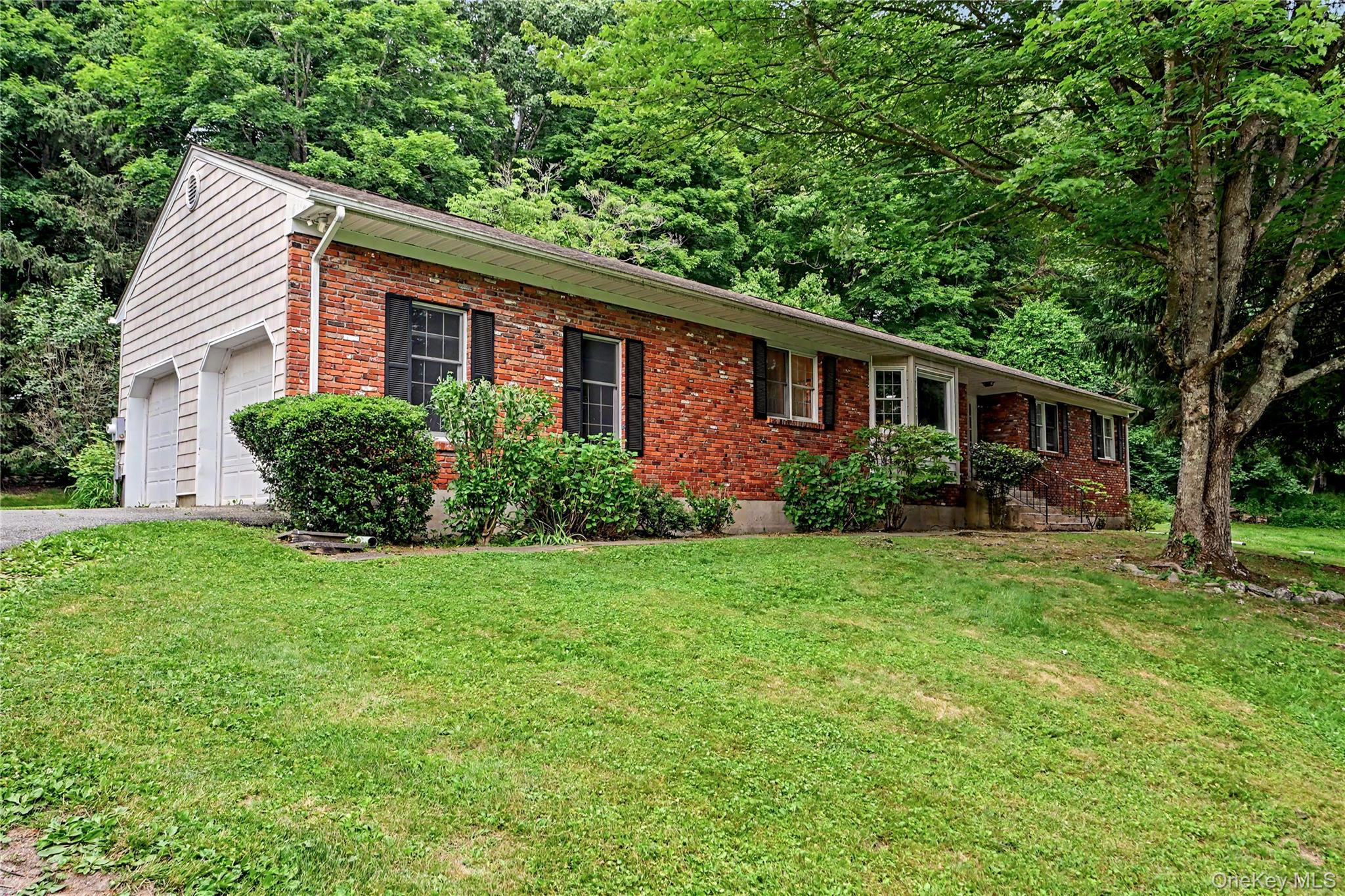 Perfect as a year-round residence or a private weekend retreat, this charming home offers comfortable living in a super convenient location. It sits on a quiet country road surrounded by nature, yet it is close to the highway (7 miles to I-684); train (8 miles to Katonah MTA Metro North station with direct trains to Grand Central), schools, and other everyday conveniences. This well-loved home features a contemporary open floor plan on the main level, eat-in-kitchen with access to an expanded deck, spacious dining and living rooms, comfortable family room with a fireplace, 3 large bedrooms (all on the same floor), and incredible multi-use flexible space on a lower level… A serene private setting will make you feel a world away from the hustle and bustle of urban life, and yet you are only a short drive away from Katonah and/or Ridgefield with a variety of shopping and dining options. Looking to get outside? Lewisboro town park is just 1.5 miles down Rt 35 (with swimming pools, baseball fields, volleyball and basketball courts, concert stage, walking trails, and many events and activities for residents), Ward Pound Ridge Reservation is 5.3 miles away (largest park in Westchester county with trails that are used for walking, hiking, cross-country skiing and horseback riding), and Wolf Conservation Center is 1.5 miles away. Looking to get some culture in? Katonah Museum of Art and Caramoor Center for Music are both about 7 miles away! What a perfect find! Don’t miss on an opportunity to check out this home and make it yours!