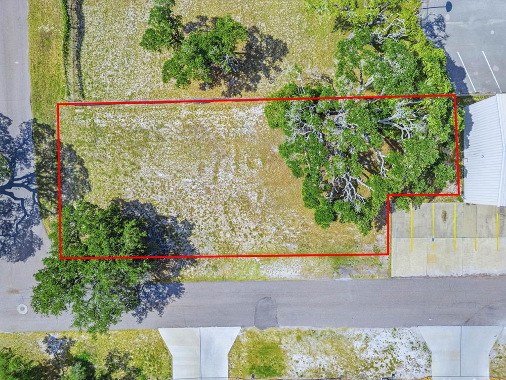 Prime Commercial Lot Behind Rockport Printing!  Fantastic opportunity to own a vacant commercial lot in one of Rockport's most visible and high-traffic locations. Situated behind Rockport Printing and surrounded by established businesses including Starbucks and Del Mar, this property offers excellent exposure and accessibility for a variety of commercial uses. Ideal for professional office suites, medical or business offices, retail services, or other commercial development. With strong surrounding traffic generators and a growing business corridor, this lot presents an exceptional investment opportunity in a desirable location. Don't miss your chance to build your business in the heart of Rockport's thriving commercial area.