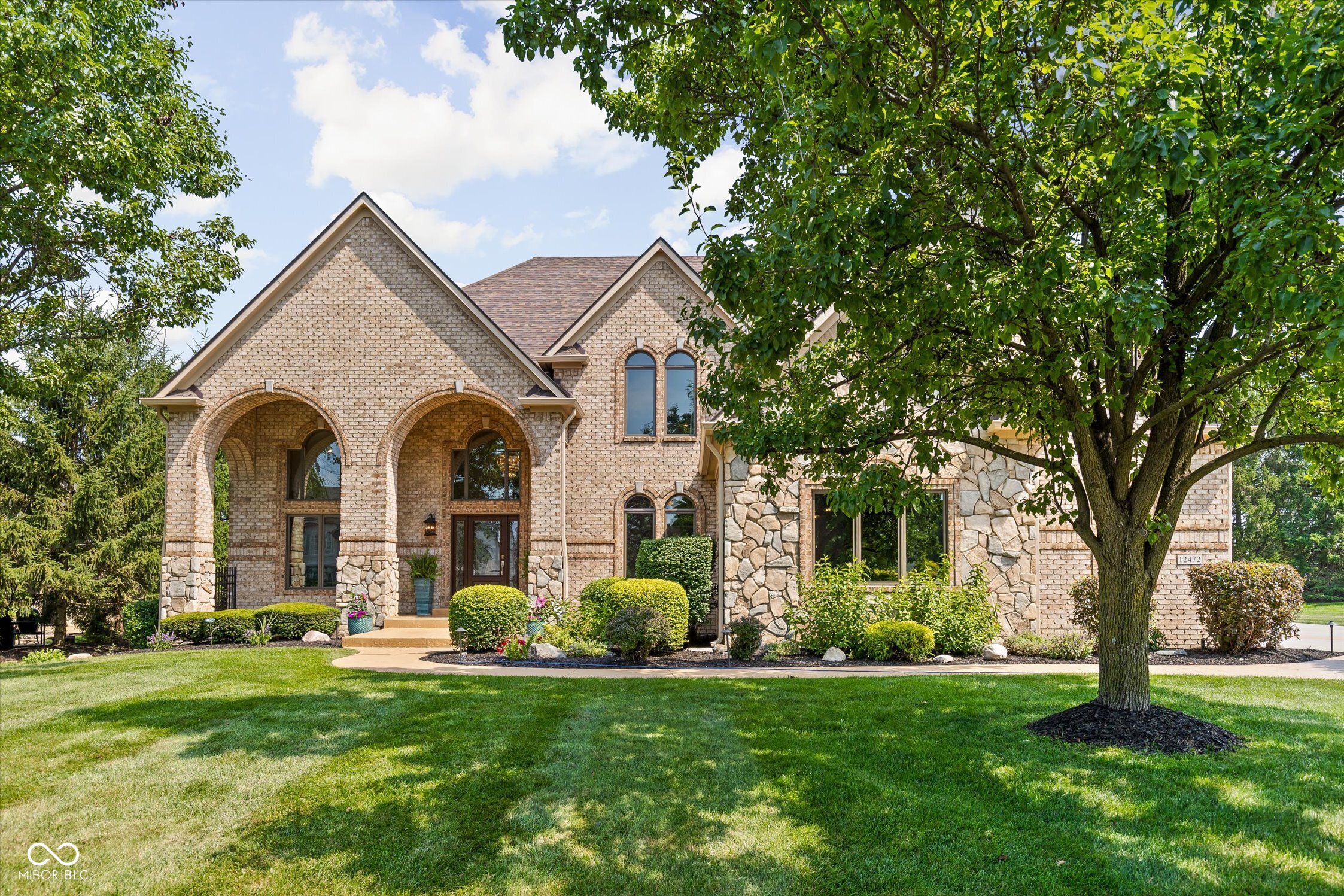 Experience exceptional luxury in the prestigious Hamilton Proper private country club community. Offering more than 8,000 square feet of impeccably designed living space, this extraordinary residence showcases timeless architecture, sophisticated finishes, and an unparalleled lifestyle.    A stunning newly remodeled chef's kitchen serves as the heart of the home, seamlessly blending style and functionality for everyday living and effortless entertaining. The expansive floor plan features six spacious bedrooms, each with its own private en suite bath, providing exceptional comfort, privacy, and convenience for family and guests.    Soaring ceilings, refined architectural details, and expansive living spaces create an inviting atmosphere that is equally suited for intimate gatherings or grand-scale entertaining. The fully finished lower level is a true extension of the home, featuring a second full kitchen, custom bar, media room, full bath, expansive recreation areas, and a dedicated exercise room that can easily function as a seventh bedroom.    Every space has been thoughtfully designed to deliver a perfect balance of luxury and livability. Whether enjoying a quiet evening at home or hosting unforgettable gatherings, this residence offers an elevated lifestyle with exceptional attention to detail.    Nestled within the highly sought-after Hamilton Proper community, residents enjoy a championship golf course, private country club amenities, and convenient access to premier dining, upscale shopping, award-winning Hamilton Southeastern Schools, and everything that makes Fishers one of Central Indiana's most desirable places to call home.    This is more than a home-it's a statement of timeless luxury, exceptional craftsmanship, and refined living.