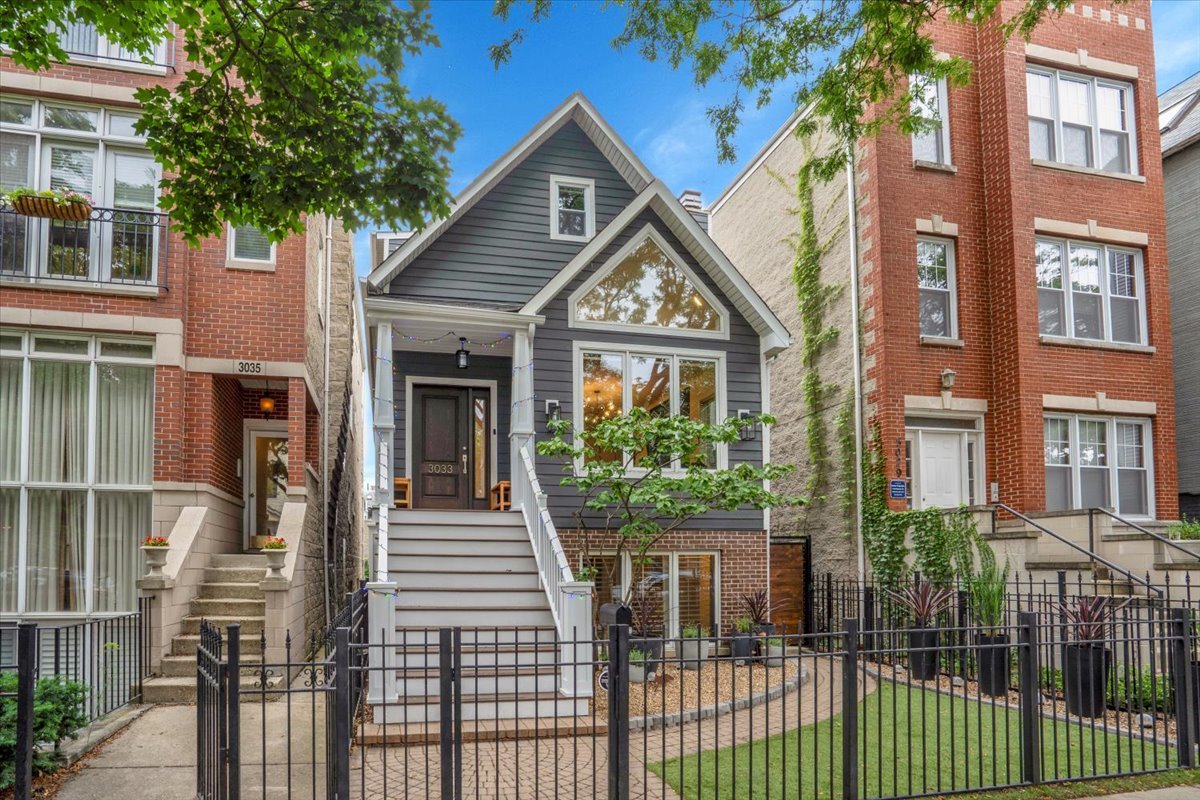 Nestled on tree-lined Seminary Avenue in the heart of Lakeview, this fully rehabbed single-family home is a rare gem, offering the quintessential city living experience in one of Chicago's most sought-after neighborhoods. Completely updated in 2025, this home is flooded with light, featuring an open floorplan on the main floor and spacious rooms throughout. Stepping into the home, you'll be greeted by new hardwood floors that flow through the foyer, formal living room with inviting fireplace, main floor dining and into the spacious chef's kitchen, featuring custom modern cabinetry, quartzite waterfall countertops, new appliances, and a large walk-in pantry equipped with abundant storage. The floor plan makes this the perfect home for hosting gatherings. Step outside to the expansive covered main floor deck, great for alfresco dining, and down to the serene backyard, where you'll find a beautifully landscaped private escape with a stone patio and soft lighting, a true sanctuary. The second floor is designed with versatility and family living in mind, featuring two spacious bedrooms, and impeccably updated baths with high-end finishes. The light-filled primary suite includes a sitting area, walk-in closet and spa-like en suite bathroom with European rain shower, heated floors and double vanity. The bottom floor walkout features a large family room with floor-to-ceiling windows, leading to multiple bedrooms, a brand new full bath, spacious storage and a large combination laundry/mudroom. The home features new plumbing, a whole-house water filter, tankless water heater, updated electrical, windows, insulation and siding. The 2 car garage offers plenty of storage. Located within walking distance of the Brown, Red & Purple L Lines, city bus lines, Lincoln Park, the lake and infinite restaurants, shops and activities, you have everything in reach, yet have the benefit of a tranquil and friendly neighborhood, tucked away on this one-way street.