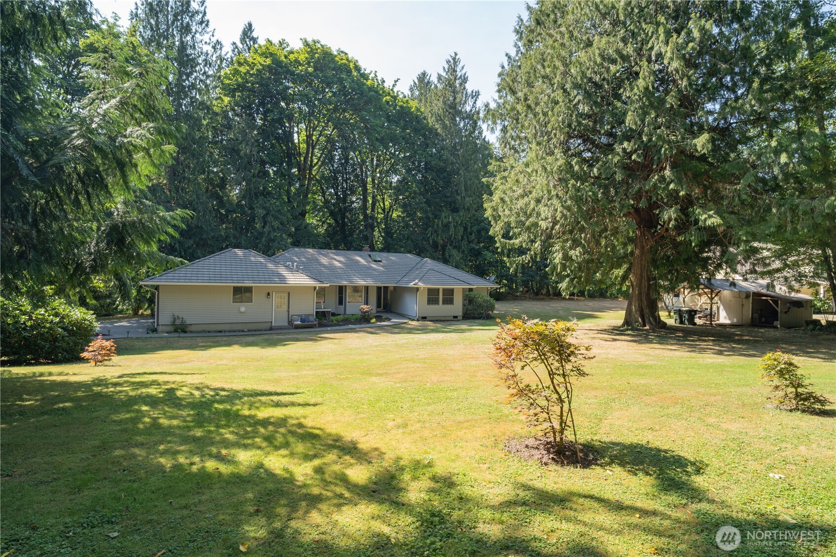 Welcome to a rare creekside sanctuary just minutes from Olympia. Set on 2.67 contiguous acres, this private retreat feels worlds away, offering the calming presence of a fish-filled creek, lush gardens, and peaceful water views in a truly park-like setting. Thoughtfully positioned for privacy and serenity, the home invites you to slow down—morning coffee by the water, afternoons spent gardening, and evenings surrounded by nature’s quiet beauty. With room for expansion, additional gardens, or a hobby homestead, the property easily adapts to multi-generational living, creative pursuits, or simply a life well lived close to town. This is more than a place to live—it’s a place to settle in, recharge, and call home.