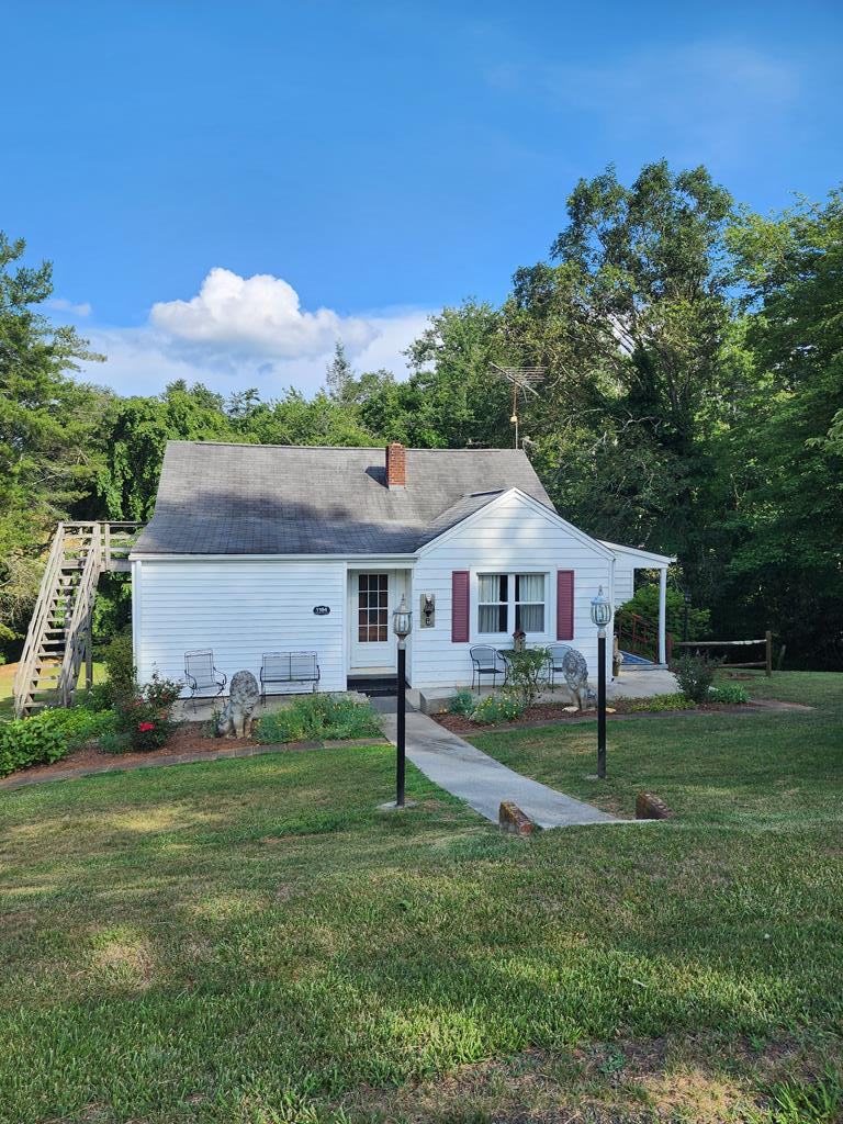 This charming 4 bedroom, 1 bath home boasts all the features and memories of grandma's house.  Well laid out floor plan offers plenty of room for family get togethers or cozy family time. Living room dining area, kitchen with breakfast area,, laundry off kitchen, four bedrooms, 2 on main level and 2 upstairs. 1 full, remodeled bathroom. Replacement windows through out. There is a full unfinished basement for your storage needs.  The house has heat pump and oil furnace heat. It sits on 1 acre of land with a small play house for the kids.  There is a bold creek that runs across the back of the property, where you can find minnows and crawdads, or just soak you feet.  Property has some history as an Airbnb and is being sold furnished.  Come back home to this special property.