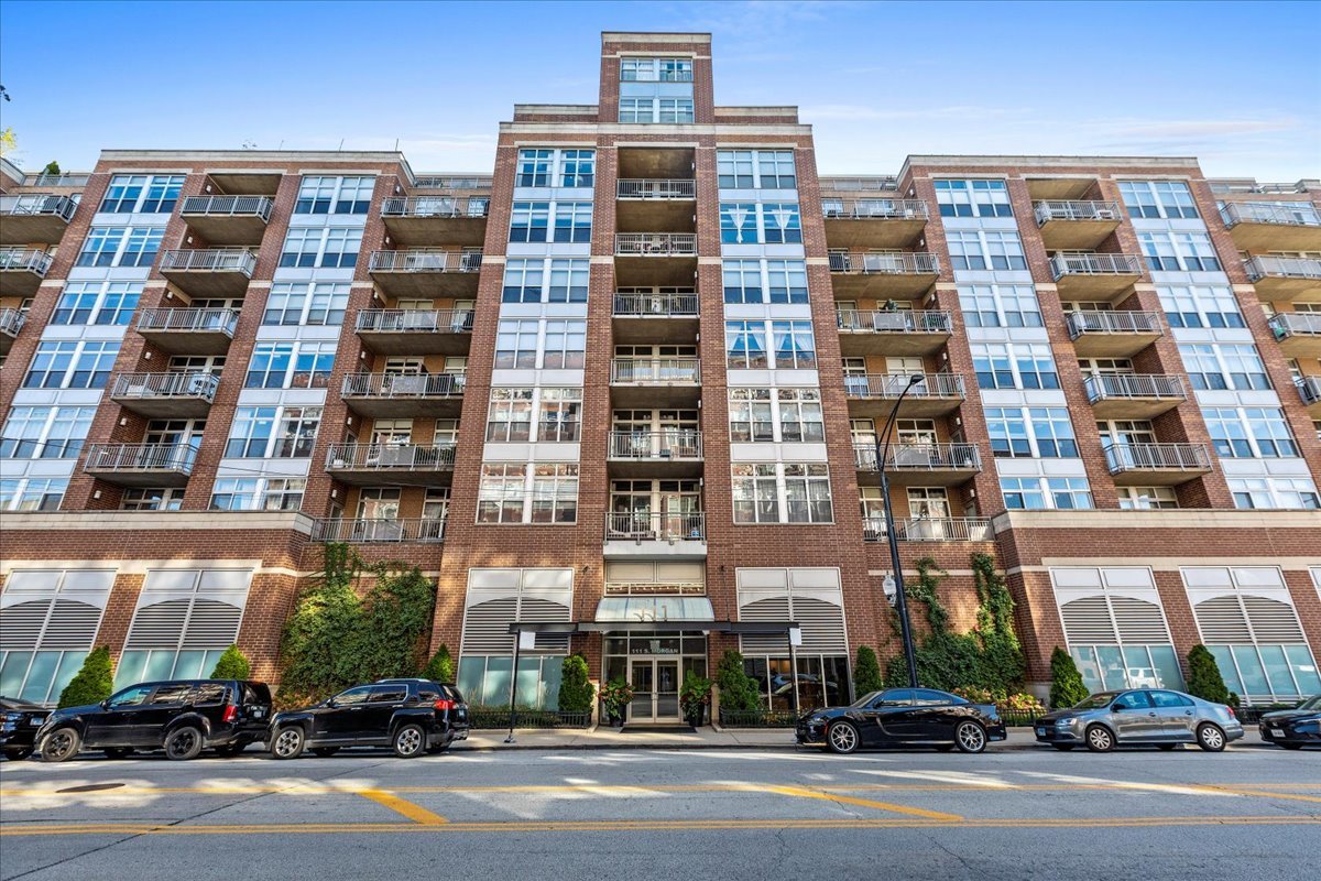 Spectacular 2BD/2BA West Loop Loft! Flooded with natural light, this spacious home features soaring 11' ceilings and dramatic east-facing floor-to-ceiling windows with skyline views and electronic blinds. Open layout with exposed concrete, gas fireplace, and updated kitchen with designer Black Stainless Steel appliances (2018) plus generous cabinet and counter space. King-sized primary suite with double vanity bath, fully enclosed bedrooms, full sized in-unit laundry (2020), and ample closet space. Private storage cage included. Relax or entertain on your expansive 31' balcony off the living room. Furnace (2018). Heated garage parking available for $25k in well maintained building with recent improvements including newer roof. Prime location steps from Whole Foods, Mariano's, Mary Bartelme Park, the farmers market, and world-class West Loop/Fulton Market dining. A rare find combining sunlight, space, and location!
