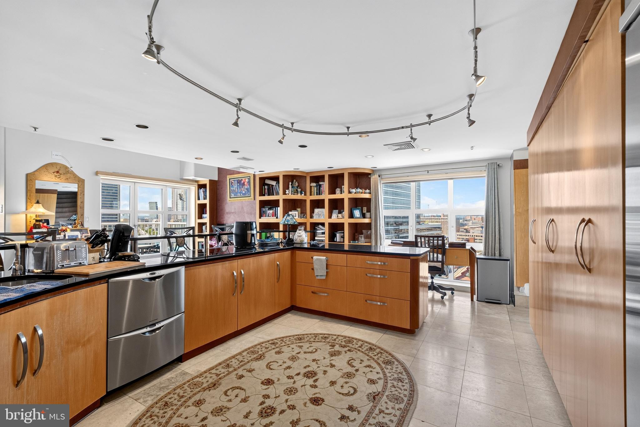 Rare opportunity to own a spacious penthouse residence in Scarlett Place Condominiums. This 3-bedroom, 2.5-bath home features an open-concept floor plan designed for comfortable living and entertaining, along with two large private balconies that provide additional outdoor living space. Three fireplaces located throughout the residence add warmth and character, while the versatile upstairs bonus room offers endless possibilities as a fourth bedroom, home office, media room, or exercise space. The upper level also includes two additional storage areas for added convenience, and a separate HVAC system.Residents enjoy exceptional building amenities, including 24/7 front desk service, an indoor pool, fitness center, library, billiards room, and community room. The residence also comes with two dedicated parking spaces located directly next to the elevator for easy access. Combining generous living space, outstanding amenities, and the convenience of condominium living, this penthouse is a must-see.Ideally located in the heart of Baltimore's waterfront district, this home is within walking distance of Little Italy and Harbor East, offering easy access to some of the city's finest restaurants, cafés, boutiques, and entertainment. Enjoy the convenience of being just a short stroll from the National Aquarium and the Inner Harbor, where you can take advantage of waterfront attractions, cultural destinations, shopping, dining, and year-round events.