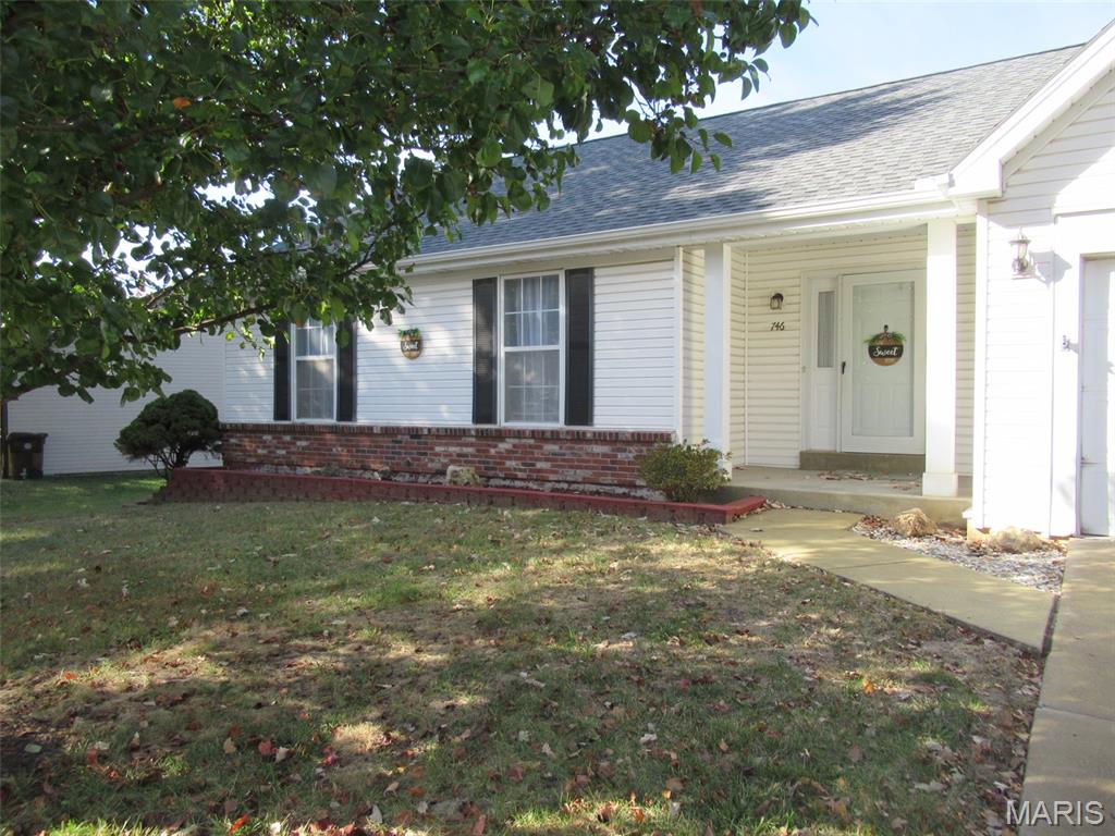 Move-In Ready Ranch with Updated Kitchen, Finished Lower Level & All New BathsWelcome home to this beautifully updated 3-bedroom, 2-bathroom ranch in a great neighborhood. Front porch allows you to sit outside and enjoy the neighborhood.   From the moment you step into the entryway (with its convenient coat closet), you'll feel the quality and care that went into every update.The living room is the heart of the home, with a cozy fireplace and a vaulted ceiling accented by a warm oak beam. Just beyond, the all-new kitchen features crisp cabinetry with modern black handles, quartz countertops, stainless steel appliances, and a separate pantry for extra storage. The adjoining dining area opens to a concrete patio, perfect for morning coffee or weekend grilling.The spacious primary suite offers a walk-in closet and a private bath with a large walk-in luxurious shower and oversized shower head, plus a dual vanity with separate mirrors. Two additional bedrooms each have large closets. The hall bath is a showstopper, with a new soaking tub and shower, double vanity, large mirror, and new lighting.The finished lower level adds valuable living space with LVP flooring, a dry bar, a new beverage fridge, and a built-in bookcase. It's ideal for entertaining, movie nights, or a game room. The unfinished portion of the basement includes washer and dryer hookups and tons of storage.Additional highlights include all new lighting, LVP flooring throughout the main level and a 2-car attached garage. Conveniently located near restaurants, gas stations, and shopping, this home offers comfort, style, and convenience in one great package.Schedule your showing today!