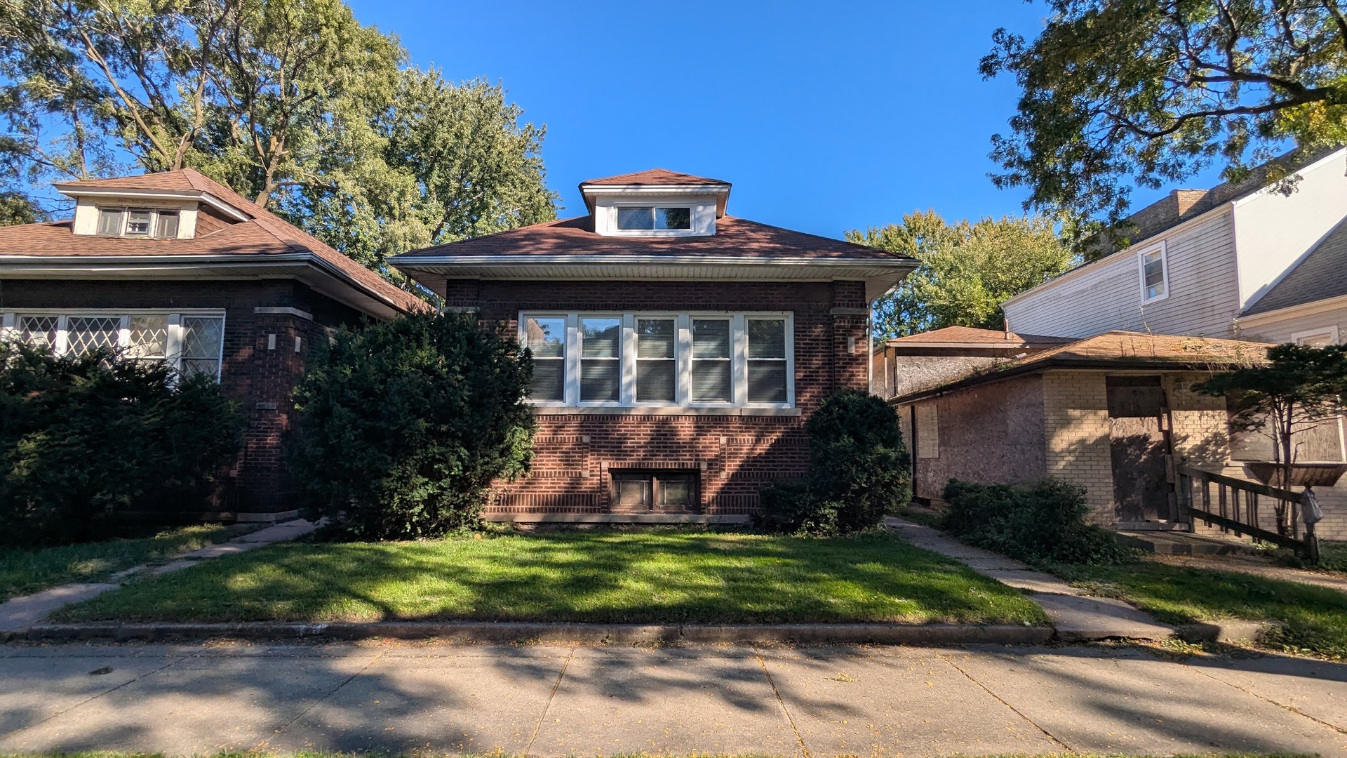 Located in the sought-after South Shore only a half mile walk to Rainbow beach park, this all-brick bungalow with 2-car garage offers tons of upgrades. The floor plan is expansive and with very spacious bedrooms. Three bedrooms are on the main level and two are upstairs. Hardwood floors run throughout the first floor. The basement is unfinished and needs some attention but the layout is already there. Home is in an ideal location being close to the lake and close to the Skyway, close to the train, and much more! Schedule your showing now! FHA AND VA BUYERS WELCOME! TEXT LA FOR LINK TO ~60 PROPERTY PORTFOLIO.