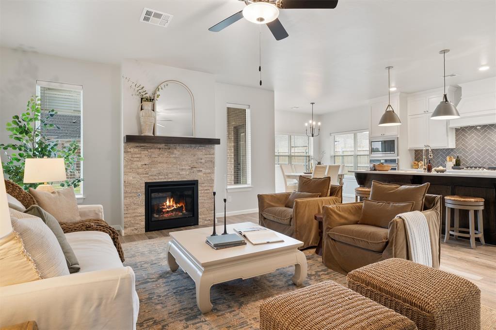 Situated on an oversized lot in the heart of Edmond, this exceptional residence showcases thoughtful craftsmanship, timeless design, and the perfect balance of luxury and livability. Every detail of this custom-built home reflects quality and comfort. The open-concept floor plan features soaring ceilings, wood-look tile flooring, and an abundance of natural light that fills each room with warmth. The gourmet kitchen is the centerpiece of the home, designed with quartz countertops, custom maple cabinetry, a farmhouse sink, stainless steel appliances, and a full-height designer backsplash - an ideal space for both everyday living and elegant entertaining. Each of the four spacious bedrooms offers a private en suite bath, providing a true sense of comfort and privacy for family and guests. The primary suite serves as a tranquil retreat, complete with a spa-inspired five-piece bathroom featuring a freestanding soaking tub, dual vanities, and a beautifully tiled walk-in shower. A thoughtfully designed closet connects directly to the laundry room for added convenience. Beyond its stunning design, this home was constructed to the highest standards of efficiency and performance. With 2x6 exterior walls, a post-tension foundation, tankless water heater, high-efficiency furnace, 16 SEER A/C, and HERS certification through OG&E’s Positive Energy program, it delivers lasting comfort and peace of mind. Outdoors, the large fully fenced yard offers endless possibilities - from serene evenings on the patio to future poolside gatherings. With a three-car garage and a prime central Edmond location near top schools, dining, and shopping, this property represents the very best in modern Oklahoma living. Experience the elegance, comfort, and craftsmanship of this remarkable home. Schedule your private showing today!