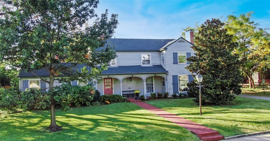 Elegant 1930s home in the heart of McKinney’s Historic District seamlessly blends timeless architecture with modern comfort. From the moment you enter, you’ll be captivated by the gracious flow and character that define this rare property. Large, light-filled rooms showcase gleaming hardwood floors, nice views, and charming vintage-inspired light fixtures that honor the home’s original charm. A welcoming entry opens to a spacious formal dining room perfect for hosting large gatherings. A beautifully appointed chef’s kitchen offers generous prep and serving space, high-end appliances, and thoughtful design for effortless entertaining.Three living areas, each with its own fireplace, provide warmth, flexibility, and ambiance for relaxation or entertaining. An inviting sunroom bathes the home in natural light~an ideal spot for morning coffee or an afternoon book.The serene primary ensuite is filled with natural light and offers a private retreat, complemented by three additional bedrooms and well-appointed baths. An office provides space for work or creative pursuits, blending seamlessly with the home’s elegant aesthetic. Step outside to enjoy the beautifully landscaped backyard surrounded by mature trees and lush greenery. The outdoor space is as inviting as the interior~perfect for dining al fresco or simply enjoying the peaceful surroundings. A rare find, the property includes a two-car garage and a fully equipped garage apartment complete with a kitchen and full bath~ideal for guests, multi-generational living, or potential income. With its combination of gracious living spaces, three fireplaces, thoughtful updates, and preserved historic detail, this home offers an unparalleled opportunity to live in one of McKinney’s most sought-after neighborhoods~just steps from the shops, dining, and charm of the Historic Downtown Square.This elegant 1930s treasure is a true testament to McKinney’s history~where character, comfort, and craftsmanship come together beautifully.