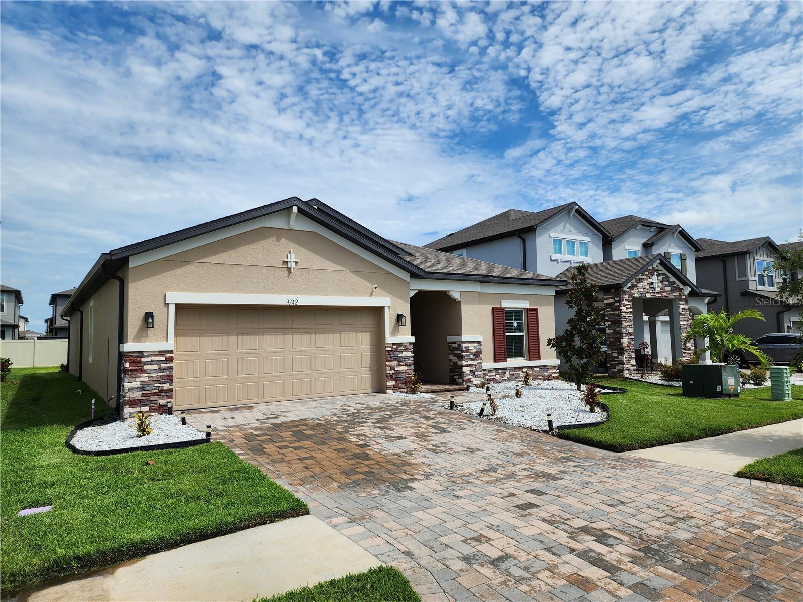 2023 Epperson Home | 4BR + Flex Room | 3BA | Screened Lanai | EV Charger.Beautiful 2023-built, 4-bedroom, 3-bathroom single-story home in the desirable Epperson community. This modern residence offers a spacious and functional floor plan, including a versatile flex room that can be used as a formal dining room, home office, study, or additional living space. The home features excellent curb appeal with a paver driveway, stone accents, landscaped front yard, and a welcoming covered entry. Inside, you’ll find bright living spaces, tile flooring throughout the main areas, generous bedrooms, and a thoughtful layout ideal for both everyday living and entertaining. Enjoy Florida living from the screened and covered lanai overlooking the backyard. Additional features include a two-car garage, ChargePoint EV charger, and whole-home water treatment system. Built in 2023 and located within the sought-after Epperson community, this home combines newer construction, flexible living space, and valuable upgrades in one attractive package. Leasing is permitted subject to HOA restrictions, including a minimum six-month lease term. It is the responsibility of the Buyer and Buyer's agent to verify the room sizes, room counts, HOA, community rules and restrictions, pet restrictions, deed restrictions, lot size, flood zone, etc. All room sizes are estimated. Please present all offers on FAR-BAR As-Is contract with pre-approval or proof of funds. Security cameras on property. Cameras may record audio and video. Entry into the property constitutes consent to recording.