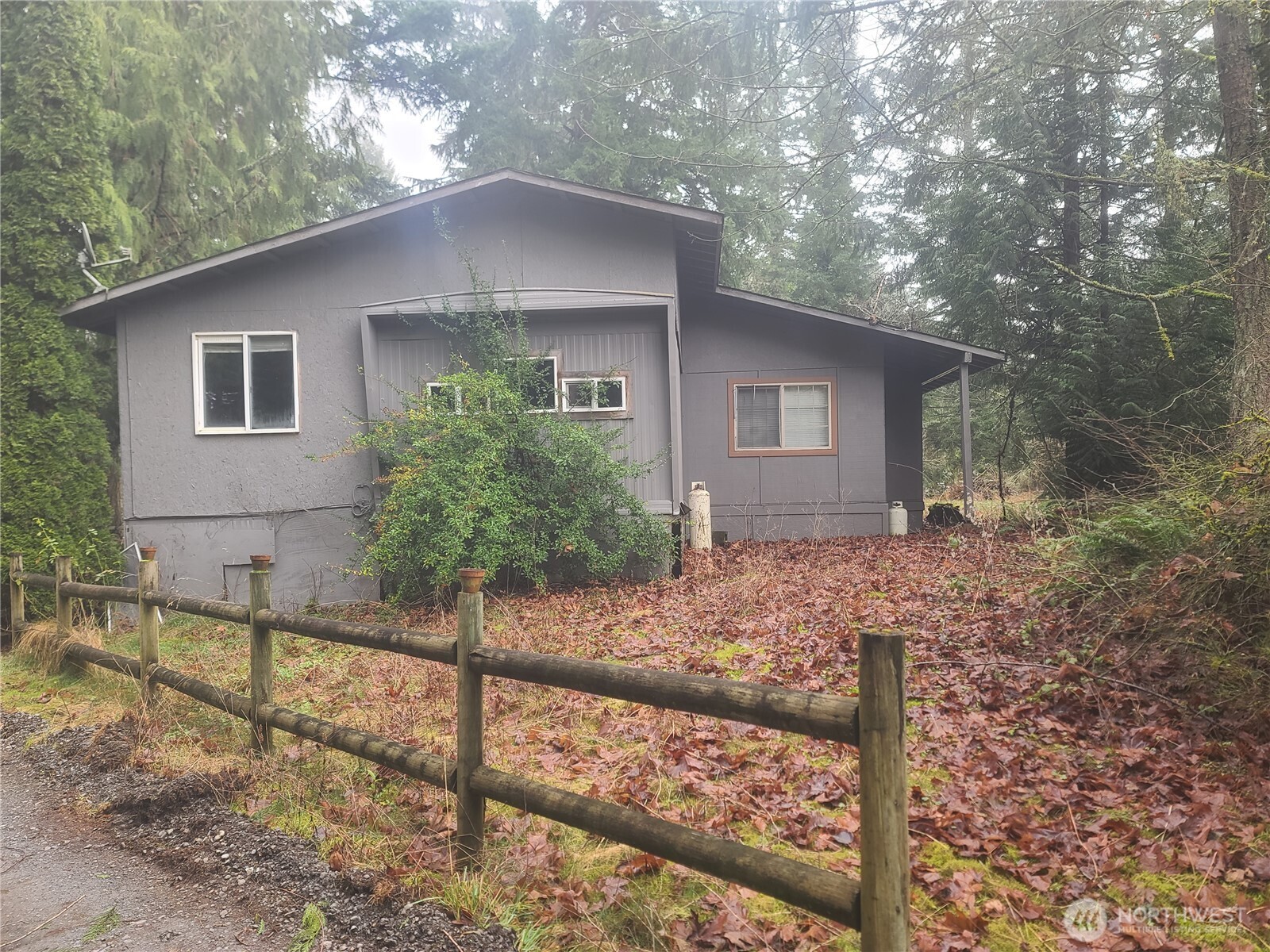 This beautiful 5 acres is level and is one of two - 5 acre parcels available through the Seller. There is a livable single wide mobile home with expanded additions and a gable composition roof built over the entire mobile home. Currently this parcel gets power and water from the neighboring 5 acre parcel. The price includes a new well and separate power installed to the mobile home. A buyer could live in the mobile home, build a new home, and use the mobile as an ADU or rental. There are also several useful outbuildings on the property. This property is also listed with the adjacent 5 acres for a total of 10 acres. See MLS # 2469188.