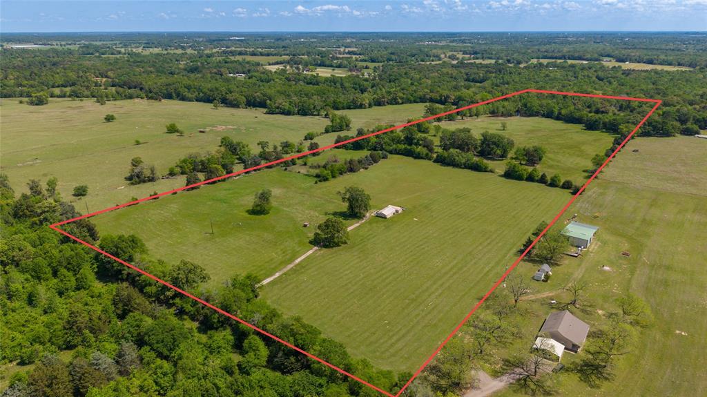 Here is a beautiful secluded hilltop building spot located near the end of quiet county maintained road. Over 50 acres with meadows, rolling hills, large scattered hardwoods, pond and much more. As your enter the property the front portion has improved grass meadows with great sandy soil that contain a good mixture of coastal, rye, Bermuda, Bahia and clovers for great grazing or hay production. At the end of the drive, there are a couple  sheds,  concrete slab, that offer some storage and work area. There is also an older well and electricity already in place. Through the middle of the property the rolling hills (over 40 ft. elevation changes) with large shade trees that overlook the remainder of the property and with a stock pond at the bottom of the hill that provides surface water for livestock, wildlife  and some recreation. Property is approximately 80-85% open but with enough trees for shade, wildlife, character and privacy. There is a set of steel corrals that would be great for a few cows and horses. Property is fenced on 3 sides with older cross fence. This place has several building locations that are in site of road or build behind the trees. This would be a great place for a new home, family retreat, recreation, hunting or a get away. No known restrictions allow you multiple homes and to do it your way. Located only 5 miles from Winnsboro, but still very private. With Lake Fork, Lake Winnsboro and Lake Quitman all within 15-20 minutes, plenty of fishing spots and recreation opportunities for all.