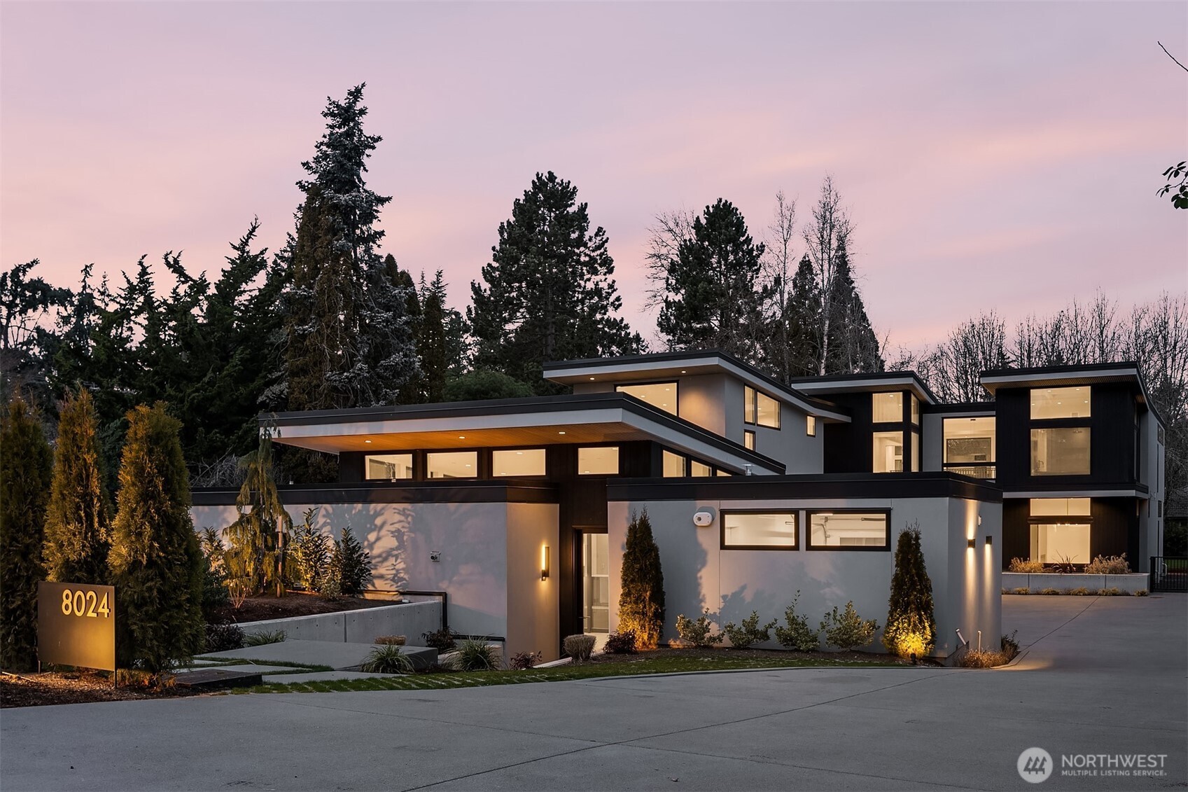 Elegant, elevated and filled with natural light, this exceptional residence offers a refined balance of architectural presence, thoughtful design and estate scale living. Sited on a flat half-acre lot & complemented by a 1-bedroom guest house, the property delivers presence & everyday livability. The main home is discreetly tucked down a private drive, where a dramatic pivot door opens to a stunning great room with soaring 20-foot ceilings & skylights defining the great room. The kitchen is designed to impress & perform, featuring an expansive 18-foot island, full prep kitchen, premium appliances & custom cabinetry ideal for daily living. Fleetwood sliding doors extend the living space to a large covered patio with skylights, built-in BBQ, fireplace & heaters, opening to expansive, flat grounds—an entertainer’s dream year round. Each bedroom is thoughtfully designed with its own en suite bath & walk-in closet. The primary suite is a true sanctuary, offering a serene bath, abundant closet space with a three-way dressing mirror & a thoughtful dressing hall with built-ins and a refreshment station. Floor to ceiling windows flood the space with natural light. The detached one-bedroom guest house offers flexibility for extended stays, a home office, or additional living space, complete with a kitchen, one-car garage & its own courtyard with a built-in BBQ. Ideally located steps to Medina Park, the Beach Park & the neighborhood Kitchen and Market. This half-acre setting delivers.