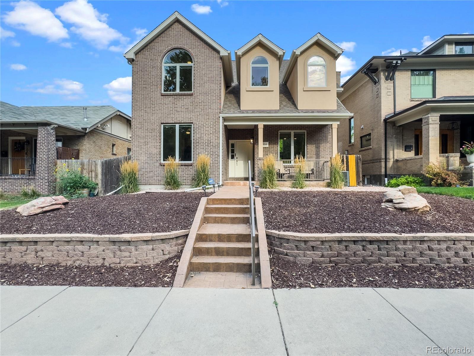 Set on a quiet, tree-lined block minutes from downtown Denver & East High School, this home offers the space, flow, & energy today’s buyer is searching for, standing out among new builds. Imagine being steps from City Park or coffee at a nearby café, then returning home to a light-filled open floorplan designed for modern living. Spanning 3,733 square feet across three levels, this home was built with flexibility in mind.Main floor features an inviting living room w/gas fireplace, soaring ceilings, & oversized windows that make entertaining effortless. A large kitchen w/counter seating and island, pantry, & stainless appliances connects seamlessly to dining & living areas. A main floor office which includes a wet bar and wine fridge supports hybrid or work-from-home needs w/out compromising your living space. Upstairs, 3bedrooms offer options for every stage of life. The primary suite is a retreat w/generous proportions& an en-suite bath, while secondary bedrooms accommodate guests, kids, or studio use. The open-to-below design adds architectural character & an airy feel. The finished lower level with high ceilings extends your lifestyle w/a full family room & second wet bar which includes a wine fridge&ice maker and fantastic wine display wall—perfect for entertaining friends.additional bedroom&bath make the basement ideal for guests or multigenerational living. Step outside to a private fenced yard and patio, where outdoor dining & summer evenings come naturally. 2car attached garage w/driveway that accommodates four extra cars is great for Jazz in the Park on Sunday evenings in the summer, adds convenience in a walkable neighborhood. The location places you near City Park golf course, Denver Zoo, Museum of Nature and Science, & top restaurants. Built in 2003&well maintained, this home balances timeless design w/modern function. 18owned solar panels convey so your electric bill will rarely exceed $20/month even in the height of summer.
