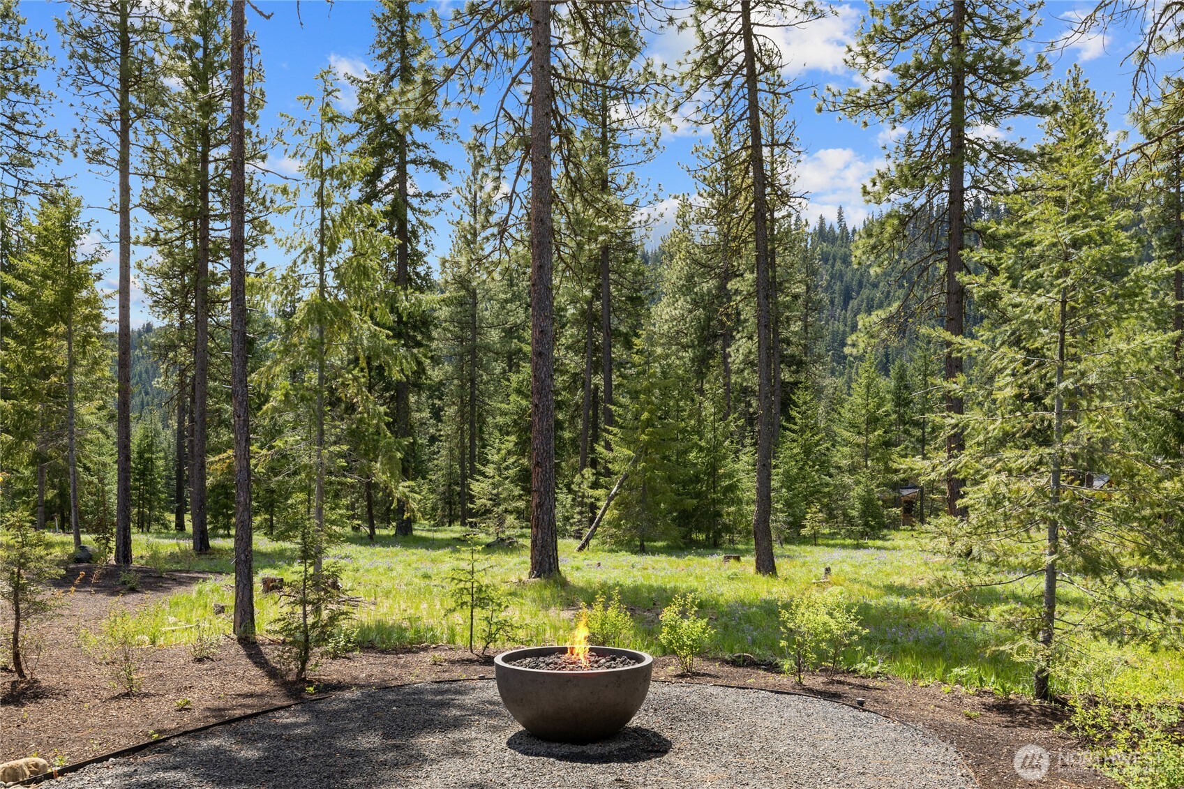 Gas firepit nestled up against Domerie Park.