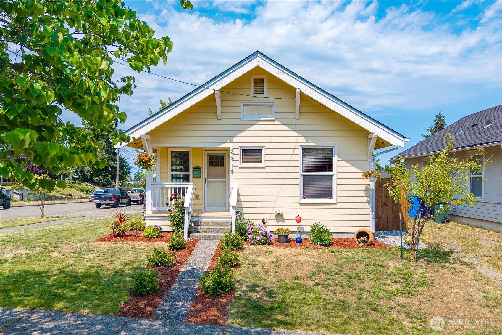 Welcome to this beautifully updated 2-bed, 1-bath North Tacoma bungalow, where Craftsman character meets modern comfort on a sunny corner lot in a quiet, sought-after neighborhood. You're less than 10 minutes from Point Ruston, Point Defiance, the Proctor District, Jane Clark Park, waterfront trails, dining, & shopping. Convenience & character, all in one address. Inside, hardwood floors & abundant natural light set the tone for a floor plan that's cozy & instantly feels like home. The updated kitchen & bath bring modern style & functionality, & extensive improvements throughout the home provide lasting peace of mind. New wiring, PEX plumbing, new HVAC system with all-new ductwork, an energy-efficient heat pump, whole-home dehumidifier, built-in HALO air purification system, vinyl windows, Hardie Plank siding, added insulation, & a new water line to the street mean many of the home's major systems have already been updated. Downstairs, the washer & dryer are located in the full unfinished basement (786sqft) with exterior access, offering flexibility for storage & hobbies. Outside, enjoy a fully fenced backyard with a stamped concrete patio, with plenty of room to relax, entertain, or garden. Ample off-street driveway parking & the possibility to add a future garage or shop (buyer to verify options). Thoughtfully updated, exceptionally maintained, & ideally located in the heart of North Tacoma, this is a home you'll love coming home to.