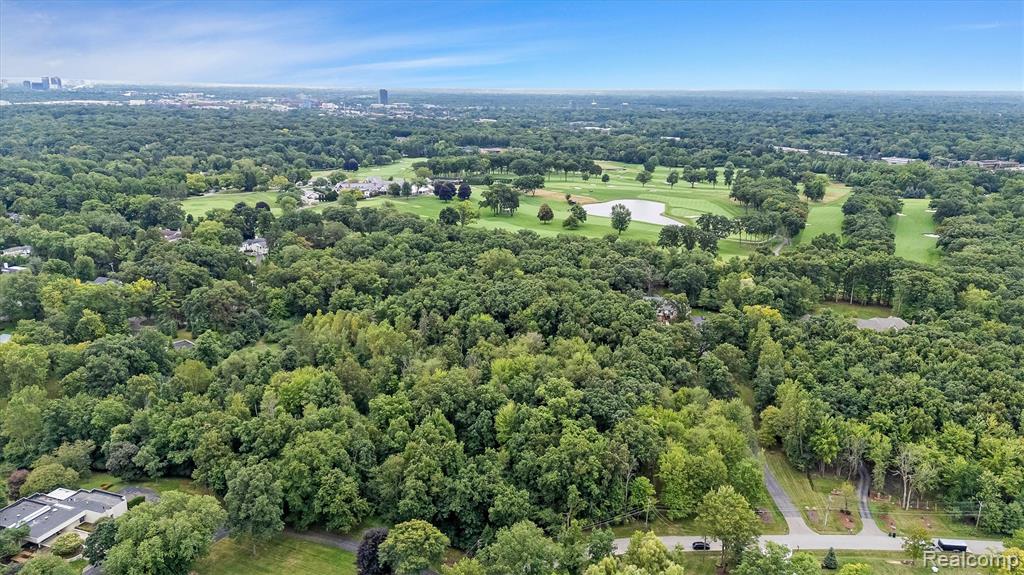 Tucked away on the serene and picturesque Rockridge Lane in Farmington Hills, this rare 10+ acre residential parcel offers a truly unique opportunity to own a large, secluded piece of land within the city limits. Heavily wooded and rich with majestic, mature trees, the property provides a tranquil, natural setting ideal for a private estate. With approximately 400 feet of shared border along the prestigious Franklin Hills Country Club golf course, the parcel enjoys stunning views, unmatched privacy, and a calming atmosphere. Whether you're envisioning a luxurious retreat or a peaceful sanctuary surrounded by nature, this exceptional piece of land is a hidden gem waiting to be discovered. Survey available upon request.