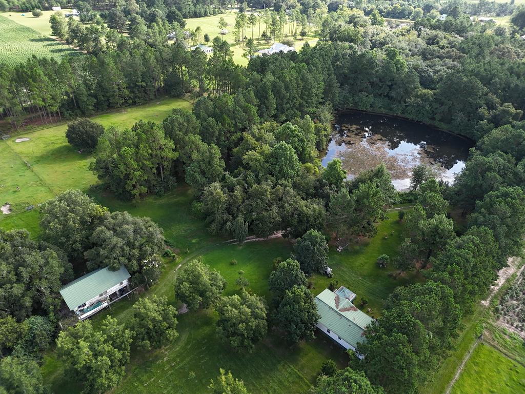 Imagine your own homeplace on nearly 28 ACRES in Thomas County, GA! This rare property can be found at 4056 Egg & Butter Rd.! At the center of this beautiful tract stands a 3BR/2Bath mobile home with a front porch and great views all around. There is a wonderful pond, lots of planted pines, and plenty of room to room. There is also a second mobile home at the front of the property, and another home located near the main house – a total of 3 HOMES which can be rented, renovated, and MORE. Call your favorite agent TODAY for a closer look at this unique opportunity!