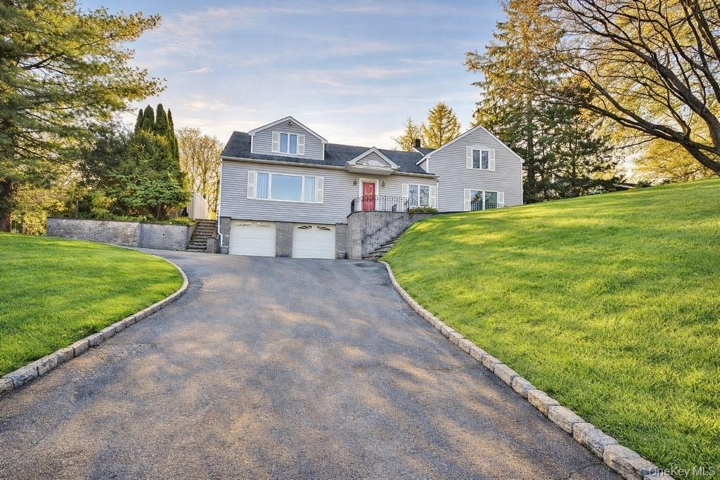 Located in a highly desirable area, this updated and expanded home offers a spacious, open layout perfect for modern living. The first floor features hardwood floors, recessed lighting, and an updated kitchen with stainless steel appliances, granite countertops, and a breakfast nook with access to the deck. The large family room, complete with a wet bar and backyard access, flows seamlessly into the siting room, which opens to the light filled living room and dining area. An updated full bath and a spacious laundry room round out the main level.  Step outside to the private, fenced rear yard with a patio and covered deck—ideal for outdoor entertaining. Upstairs, you'll find four bedrooms, including a serene primary suite with a walk-in closet and a jacuzzi tub. A hall bath serves the other bedrooms.  The unfinished basement offers ample storage, two above-ground oil tanks, and access to the garage. Conveniently located near shops, restaurants, parks, schools, and the parkway, this home is move-in ready! There are no audio recording devices inside this property.