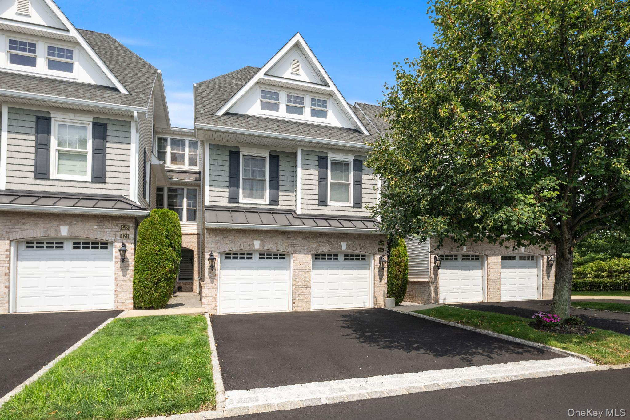 Welcome to 469 Pacing Way! This stunning villa, located in the prestigious Meadowbrook Pointe Athletic Club & Spa, is a gated 55+ luxury community in the heart of Westbury. Spanning approximately 2,628 square feet across three thoughtfully designed levels, this 2-bedroom, 2.5-bath home with a versatile home office that can be used as an additional sleeping area, den, or media room, a spacious one-car garage, and a private elevator offers an exceptional blend of comfort and convenience. The home features an open kitchen with updated stainless-steel appliances, generous living and dining areas, a breakfast area/eat-in kitchen, and a private balcony. The expansive primary suite includes its own balcony, a spa-like en-suite bath, an oversized custom-fitted WIC, along with two additional closets, creating an abundance of storage. The generously sized second bedroom features another custom-fitted WIC and the en-suite bathroom. Additional highlights include central HVAC, a dedicated laundry room, powder room, and storage galore.Residents of The Meadowbrook Pointe enjoy an exceptional collection of state-of-the-art, resort-style amenities, including a 25,000-square-foot clubhouse offering everything you could ever want in a home. The amenities that are at your disposal include indoor and outdoor pools, a fitness center and spa, cafe, movie theater, ballroom, tennis and bocce courts, and a full calendar of social activities. The grounds of Meadowbrook Pointe are truly spectacular and meticulously maintained. Being centrally located, you will be within minutes of the best shopping and dining areas, with easy accessibility to a wide range of transportation routes and options. This is more than a home, this is a lifestyle that offers the perfect balance of luxury, tranquility, and convenience.