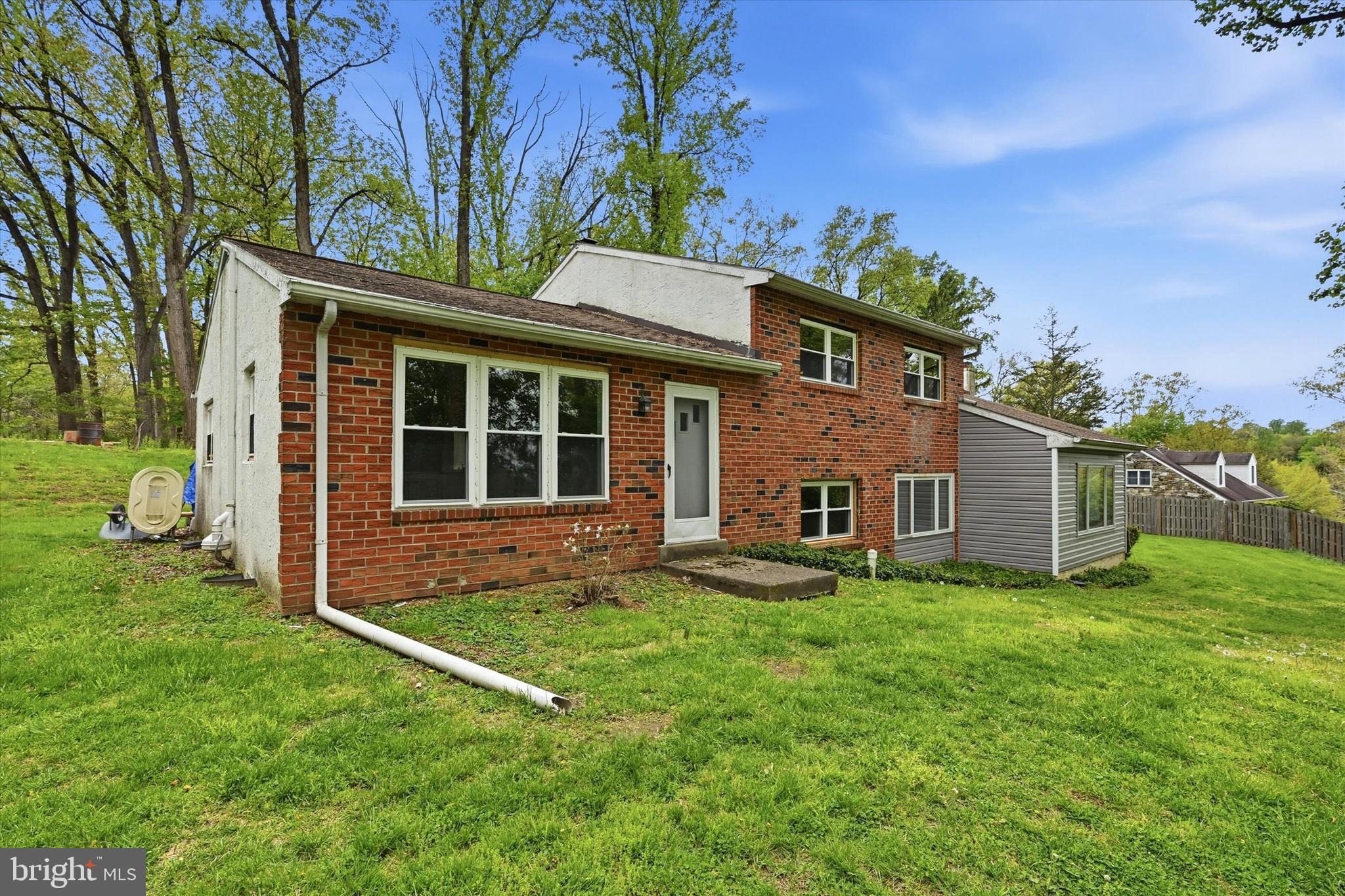 Welcome to 1551 Conestoga Road! Don't miss this beautifully renovated 4-bedroom, 2 full-bath home in the highly sought-after Downingtown Area School District. Thoughtfully updated throughout and spread across three well-designed levels, this home is truly move-in ready — offering the perfect blend of modern finishes, flexible living spaces, and everyday comfort. The main level is made for both relaxed living and easy entertaining, with a dining room that flows through sliding doors to a private deck, a generous living room, and a well-appointed kitchen. Three bedrooms and a full bath round out the upper level. Head down to the entry level and you'll find the home's showstopper — a dramatic family room with soaring vaulted ceilings, a fourth bedroom ideal as a home office or guest suite, a full bath, and a laundry/utility room. Plenty of room for everyone. Schedule your showing today!