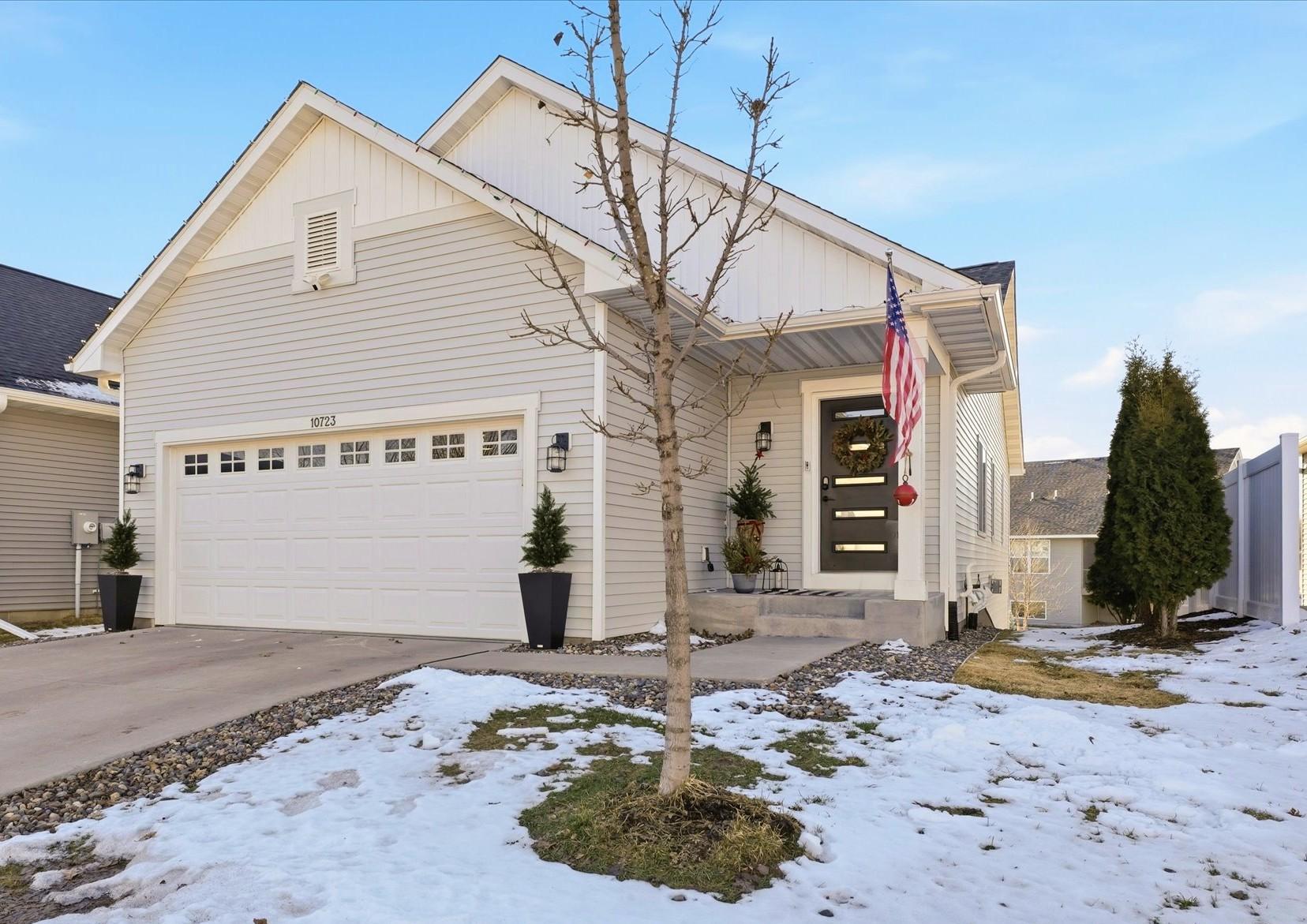 Step into a home where thoughtful design, modern comfort, and elevated style come together effortlessly. Tucked into the serene, park like setting of Highland Knolls, this beautifully upgraded single family home offers a designer lifestyle with the convenience of lawn care, snow removal, and sanitation all handled for you.Sunlight pours through expansive windows, illuminating an open floorplan enhanced by vaulted ceilings, custom trim work, and whole house luxury vinyl plank flooring. Designer lighting, removable accent wall murals, custom blinds, and a full Ring security system elevate both style and peace of mind.The kitchen is the heart of the home, blending quartz countertops, a tile backsplash, gas stove, high capacity hood, and a generous island that invites gatheringThe main floor owner’s suite feels like a private retreat with its walk in closet, custom maple storage, and spa inspired ensuite featuring a 6 foot soaking tub and walk in shower with a custom frosted door.The walkout lower level extends your living space with a cozy fireplace, two additional bedrooms, a full bath, and a flexible bonus room perfect for hobbies, fitness, or guests. Outdoor living is just as impressive. A 16×16 concrete patio, rock edging, vinyl privacy fencing, and arborvitae plantings create a welcoming backdrop for relaxation or entertaining. The upgraded sprinkler system with a Rachio controller keeps everything lush with ease.Even the garage has been transformed into a highly functional extension of the home, featuring attic storage with ladder access, oak faced cabinetry with counter space, suspended shelving, a built-in vacuum system, a wall mounted TV, and a MyQ Wi Fi opener with keypad.Highland Knolls offers mature trees, walking trails, and playgrounds, all just minutes from shopping, dining, golf, and entertainment. This is more than a home—it’s a lifestyle curated for comfort, convenience, and modern living.