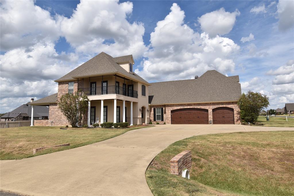 Welcome to this spacious 4-bedroom, 3-bath home located in Stonewall’s Cathey Acres community. Offering approximately 2,500 square feet of living space, this home features an open layout with vaulted ceilings, wood flooring, a fireplace, granite countertops, and a large kitchen with plenty of cabinet and counter space. Recently installed plantation shutters throughout the home add a clean, finished look and provide added privacy and light control. The primary suite offers dual sinks, a soaking tub, and a large walk-in shower. Outside, enjoy the covered front porch, upstairs balcony, and a 3-car garage providing plenty of parking and storage. Situated on a corner lot with convenient access to Stonewall and the surrounding area, this home offers plenty of space both inside and out. Schedule your private showing today!