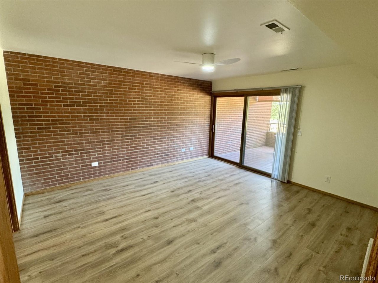 Wow! Mountain Views - ground level access condo in downtown Colorado Springs in this 2-bedroom, 2-bath is ideally situated along scenic Monument Valley Park and just one block from vibrant Tejon Street. Offering 1,459 sq. ft. of single-level living with elevator access, this home is set within the secure Park Place community featuring a gated entrance, beautifully maintained grounds, and assigned covered parking. Recently updated with luxury LVP wood look flooring for a modern feel.  Tons of windows and a private patio area.  The spacious primary suite includes a private balcony,  walk-in closet, separate toilet area, and walk in shower. The second bedroom is nearly as large as the primary, is perfect for guests or a home office.   The kitchen features ample counter space, a specialty backsplash, new stainless steel appliances and a solid surface counter top.   An open dining area flows into the expansive living room with wood-burning fireplace, and a wall of west-facing windows framing stunning Front Range views. Assigned parking space is located within the gated garage, and HOA approval is available for installing your own EV charging station. Direct access to Monument Valley Park trails offers an active, walkable lifestyle just steps from your doorway.