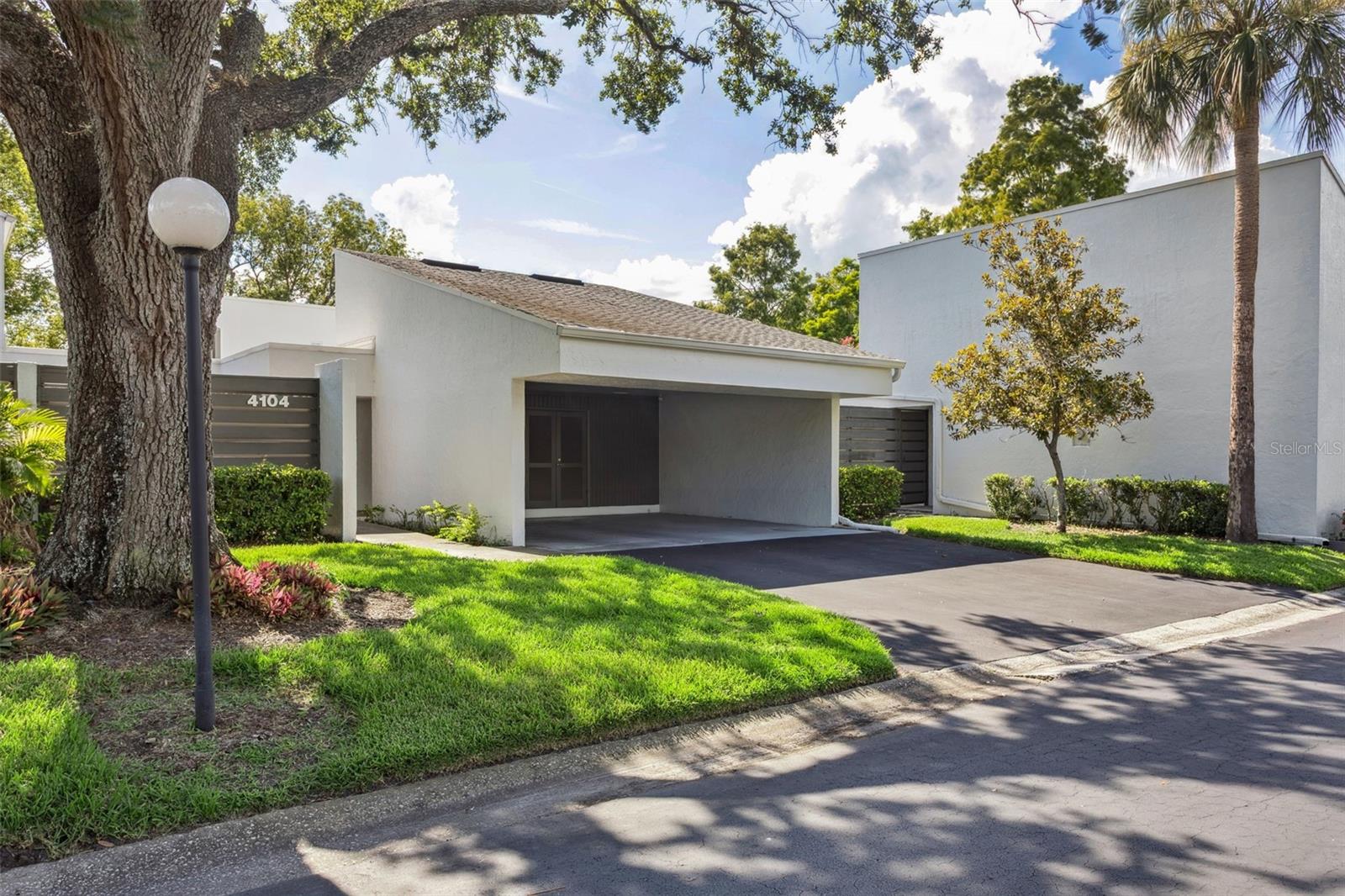 Meticulously maintained, beautifully updated and is very well cared for!!! Rare opportunity for a maintenance-free cluster home within the very desirable Carrollwood Village.
Bordering Emerald Greens Golf Club and Country Club with walking trails throughout the Village. Enter this home to an impressive formal Foyer trimmed with Millwork and
heavy Crown Molding. This stunning 2-bedroom/2-bathroom/office space/den has been renovated over the last few years and is simply stunning with high-quality finishes to
include Polished Porcelain flooring, Brazilian Cherry Engineered Hardwood flooring, 8-inch custom Crown Moldings, wall millwork and french doors throughout, adding to the
elegant, timeless craftsmanship with all the renovations. The kitchen boasts custom-made high gloss laminate cabinets with an abundance of Quartz countertops and
backsplash.  Dining room is bright to include two ceiling sky-lights with pull shades when you don't want the bright sun.  The large Living room has wall to wall sliding glass
doors out to the 16 X 11 screened  enclosed Lanai and views of the park-like setting with this lush back courtyard. Master Bathroom and Guest bathroom have been updated
with stone, granite, and porcelain tile.  New roof installed 2018, A/C 2023, Water Heater 2024. All common areas are perfectly maintained!  The community pool and spa have
recently been renovated 2025 and are gorgeous! Carrollwood Village offers many recreational amenities to include parks, tennis, basketball courts, play grounds and walking
trails. Close to Veteran's Expressway, I-275, I-4 and I-75. Located close to beaches, major sports arenas, Tampa Int. Airport, shopping, restaurants, churches and schools.