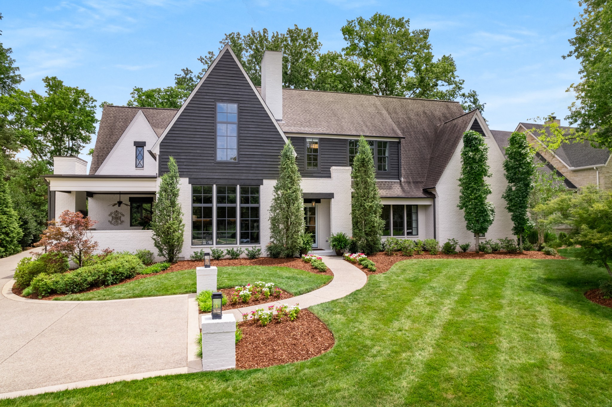 Convenience takes on a new meaning!  One of the most sought after streets in the Hillwood/ West Meade neighborhood. Lushly landscaped .48 acre property, with an understated, large, English cottage style Residence.  Gable roofs allow for dramatic, steeply pitched ceilings, many with beams.  Gentle, sloped dormers add interest and provide for wide banks of windows, flooding the interiors with light.  Open and screened porches are accessed on both main and upper levels.  The backyard is fenced for privacy.  The flexible floorplan is open, yet still defined.  The kitchen and breakfast area connects well with the family space.  'Command central'  laundry and the spacious friend's entrance/bar  are terrific.  Main level Primary with soaring ceiling.  Three additional bedrooms with en-suite baths, recreation/TV room and a large gym/office are upstairs, with a rooftop deck.  Abundant guest parking.  Unique and compelling.  Do not wait!